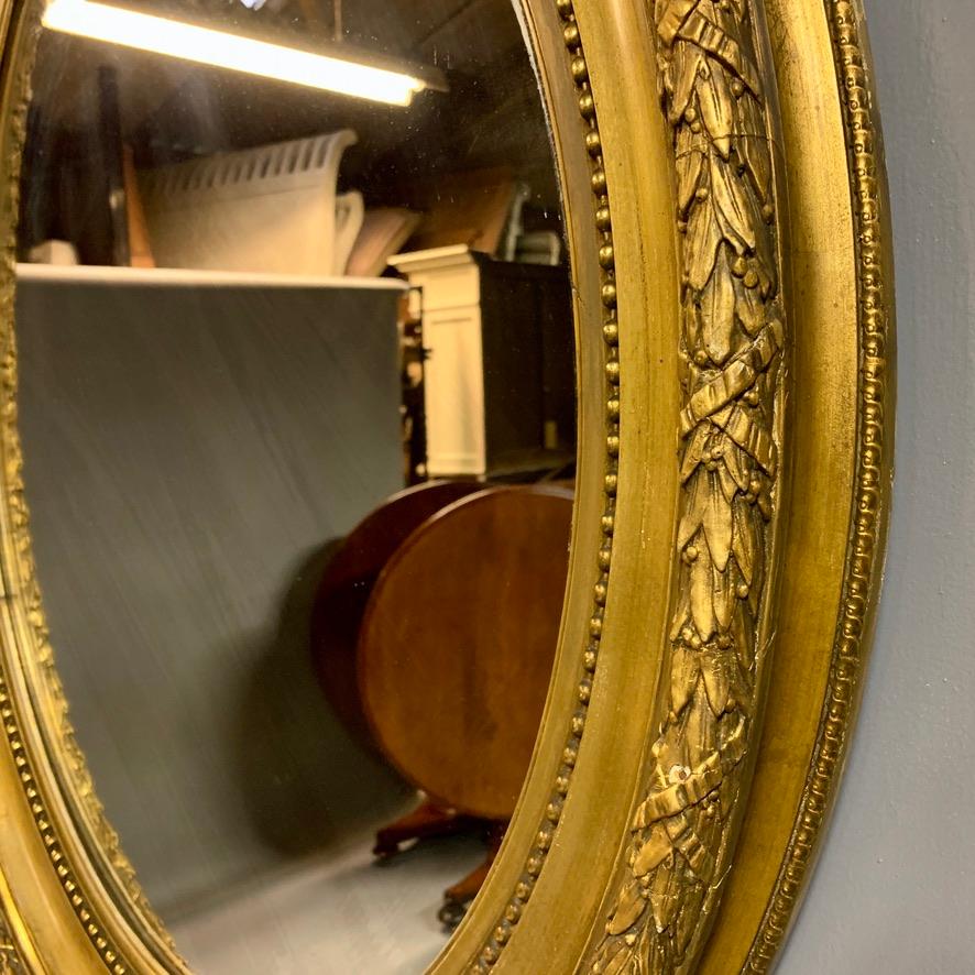 Softwood Large 19th Century French Gilt Oval Mirror with Original Bevelled Mirror Plate