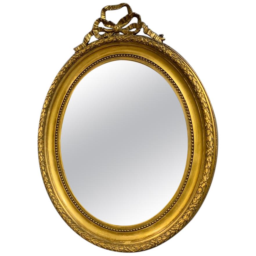 Large 19th Century French Gilt Oval Mirror with Original Bevelled Mirror Plate