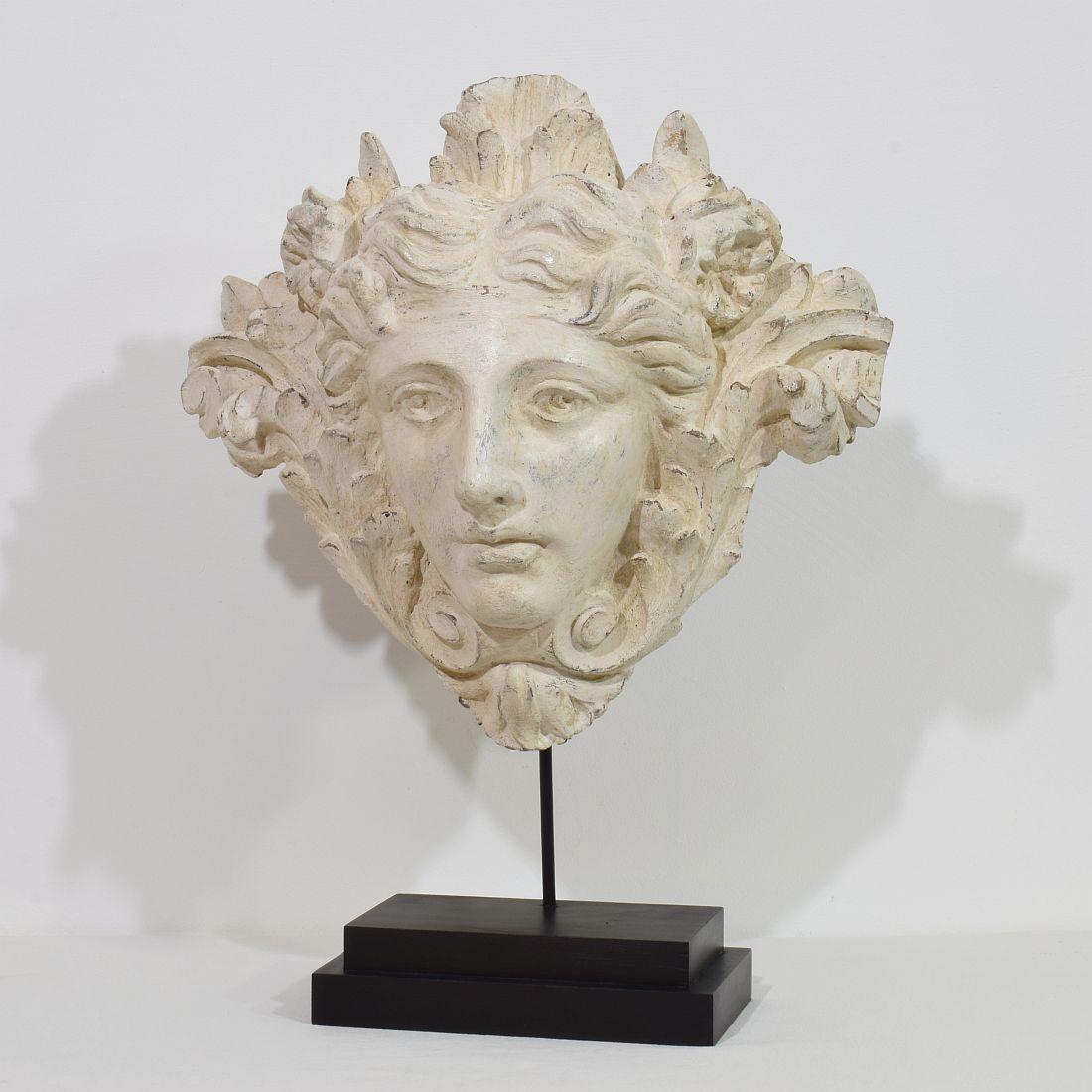 Amazing Belle époque ornament that once adorned a hallway. 
Beautiful hand-carved head with traces of several layers of paint. Really a unique period piece.
France circa 1850-1880
Weathered and small losses.
Measurements: H:45-58cm  W:46cm D:23cm