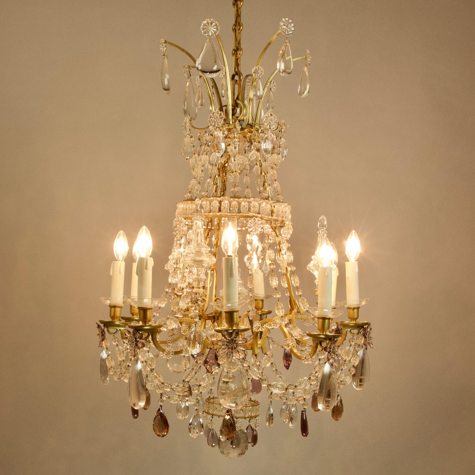 Large 19th century French Louis XV bronze crystal nine-light chandelier attributed to Maison Baguès

A large Louis XV style gilt bronze and cut crystal glass chandelier attributed to the Paris manufacturer Maison Baguès. This nine-light chandelier