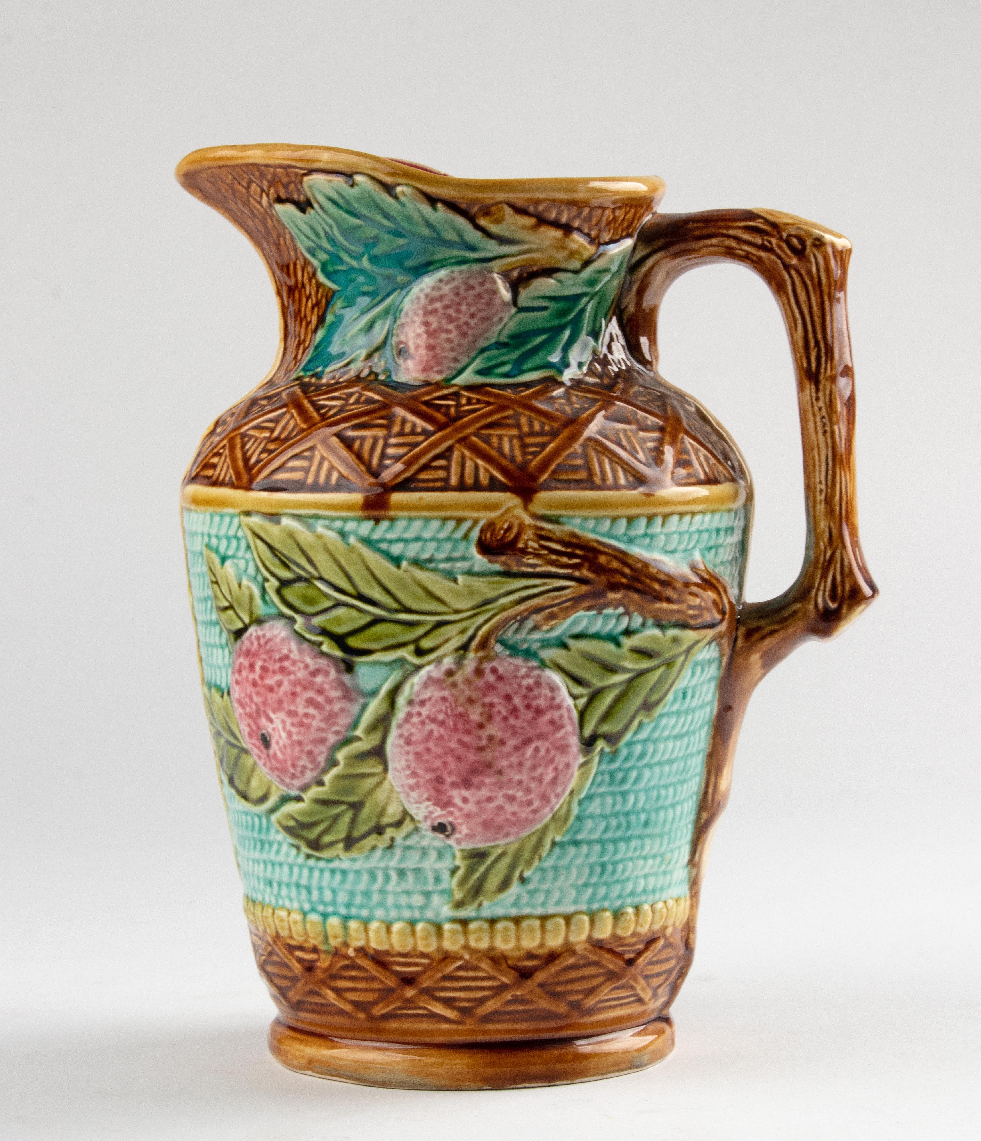 Large Majolica Ceramic Pitcher. Decorated with a pattern of apples. With very bright colors. 
Most likely a production from the Belgian brand Nimy. The pitcher is in good condition. No chips and no hairlines. On the bottom of small line (see