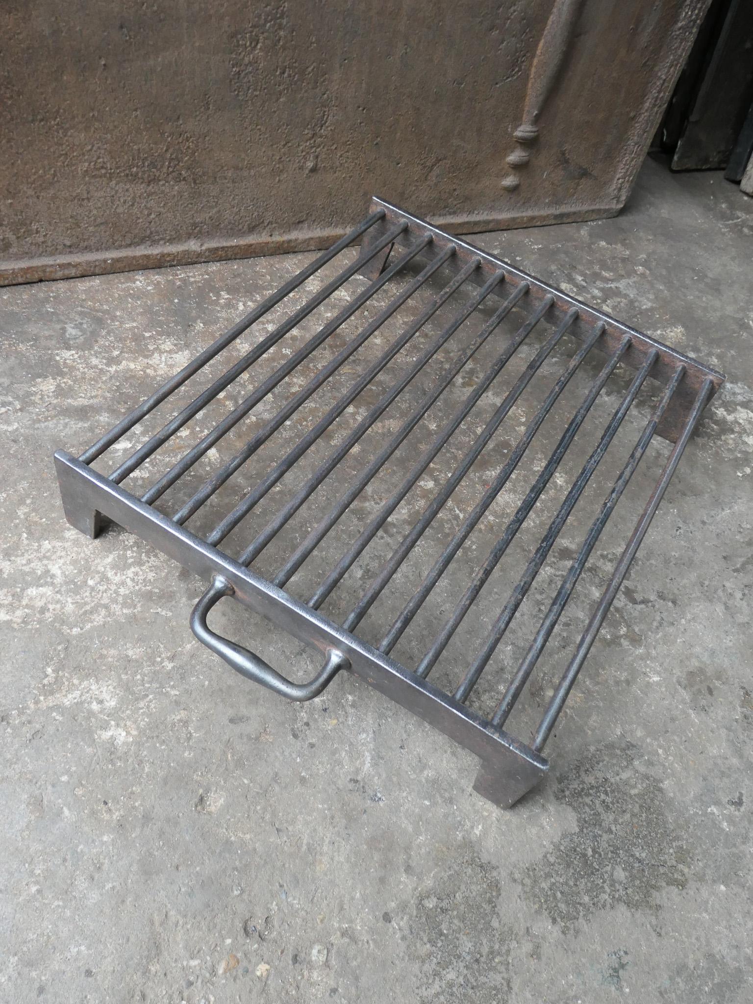 Large 19th century hand forged French gridiron, made of wrought iron. It is used to grill small pieces of meat quickly over the fire. Sometimes they are put in the fire or else on a trivet, depending on the size of the fire. The gridiron is in a