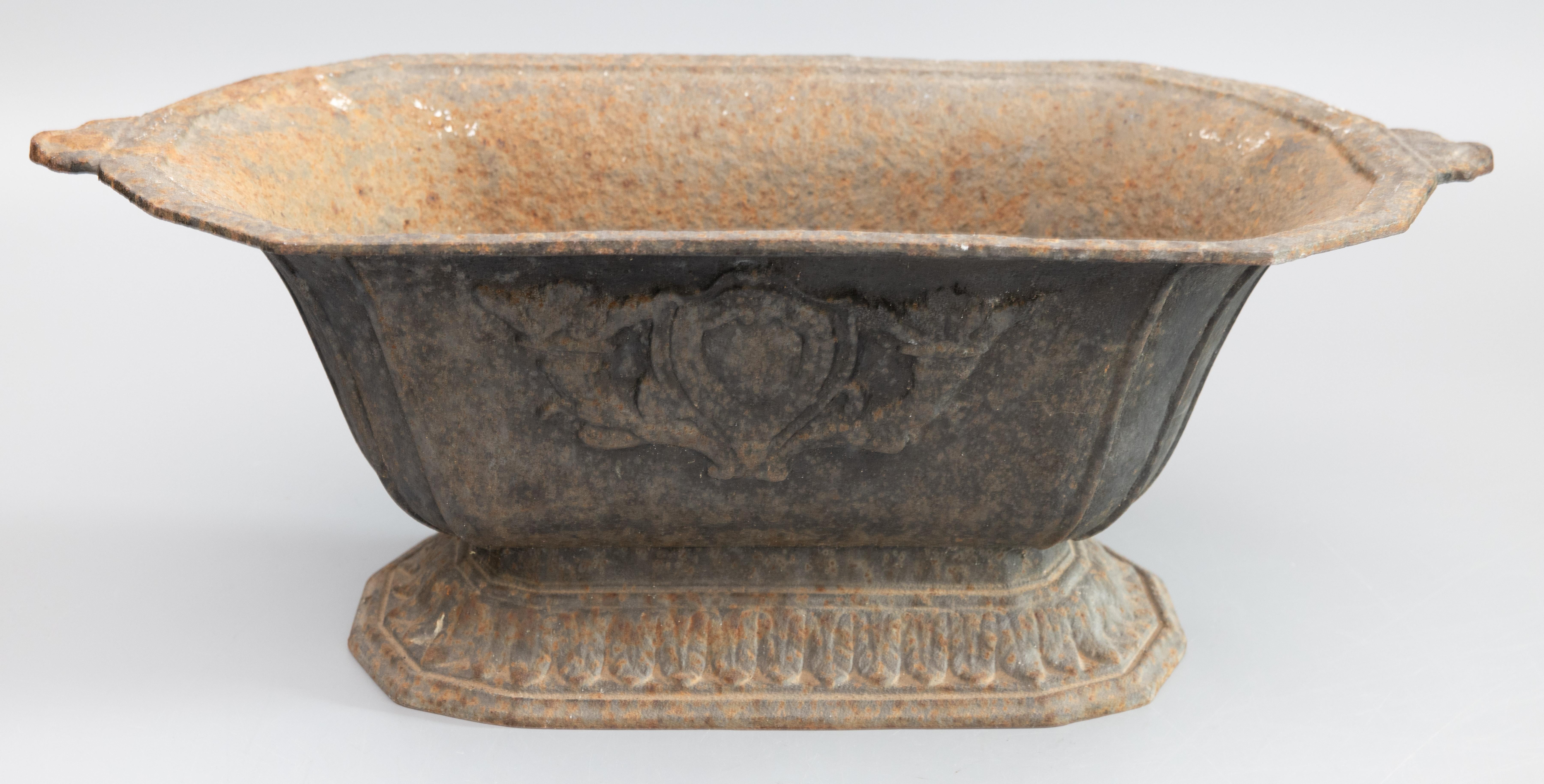 A gorgeous antique 19th-Century French cast iron jardiniere or planter with the lovely original surface and patina. This beautiful jardiniere is nice large size, heavy and well cast, with a Neoclassical design and a lovely weathered patina. It's