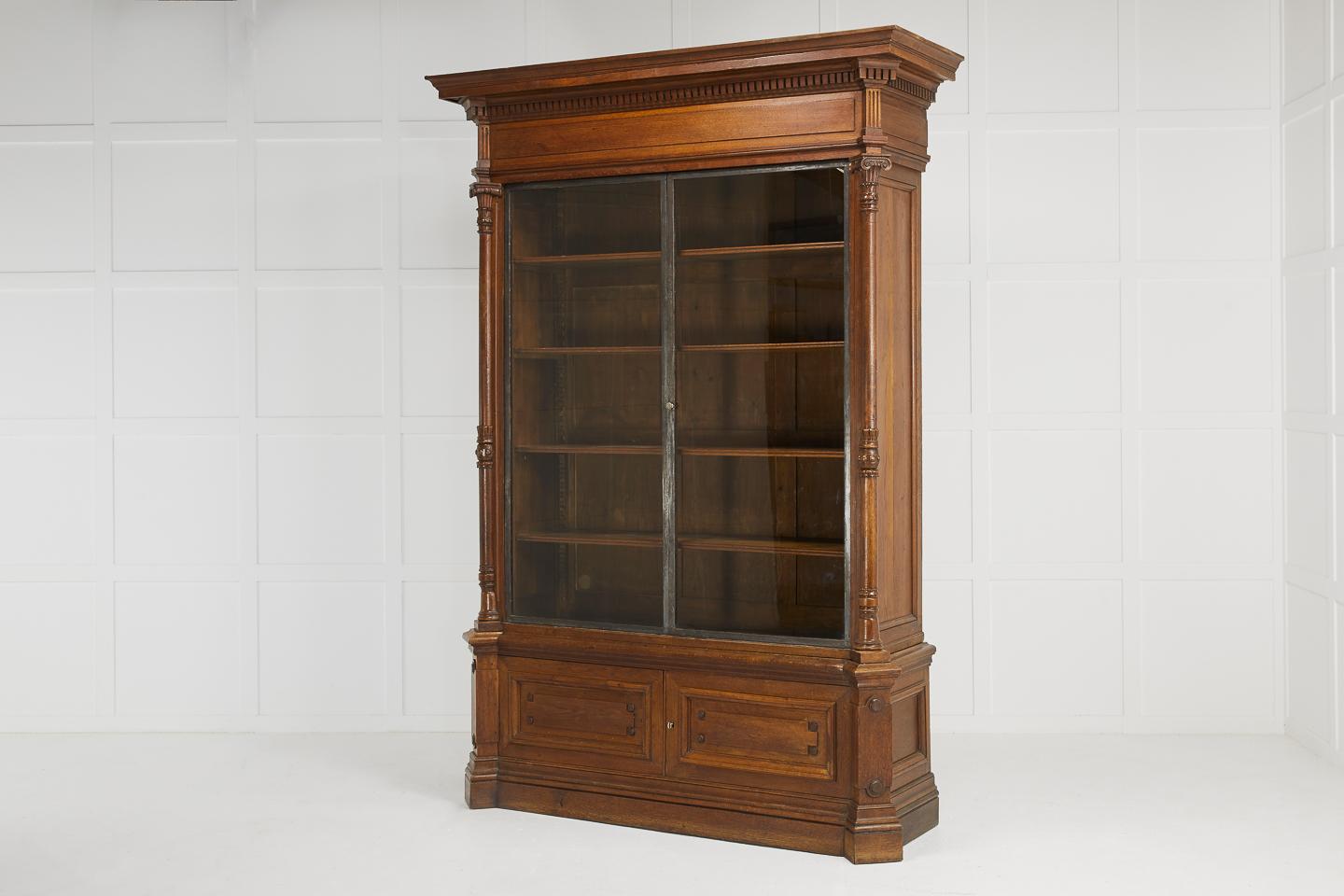 Important, large, 19th century French oak library bookcase, beautifully proportioned with glazed metal frame doors and great patina.