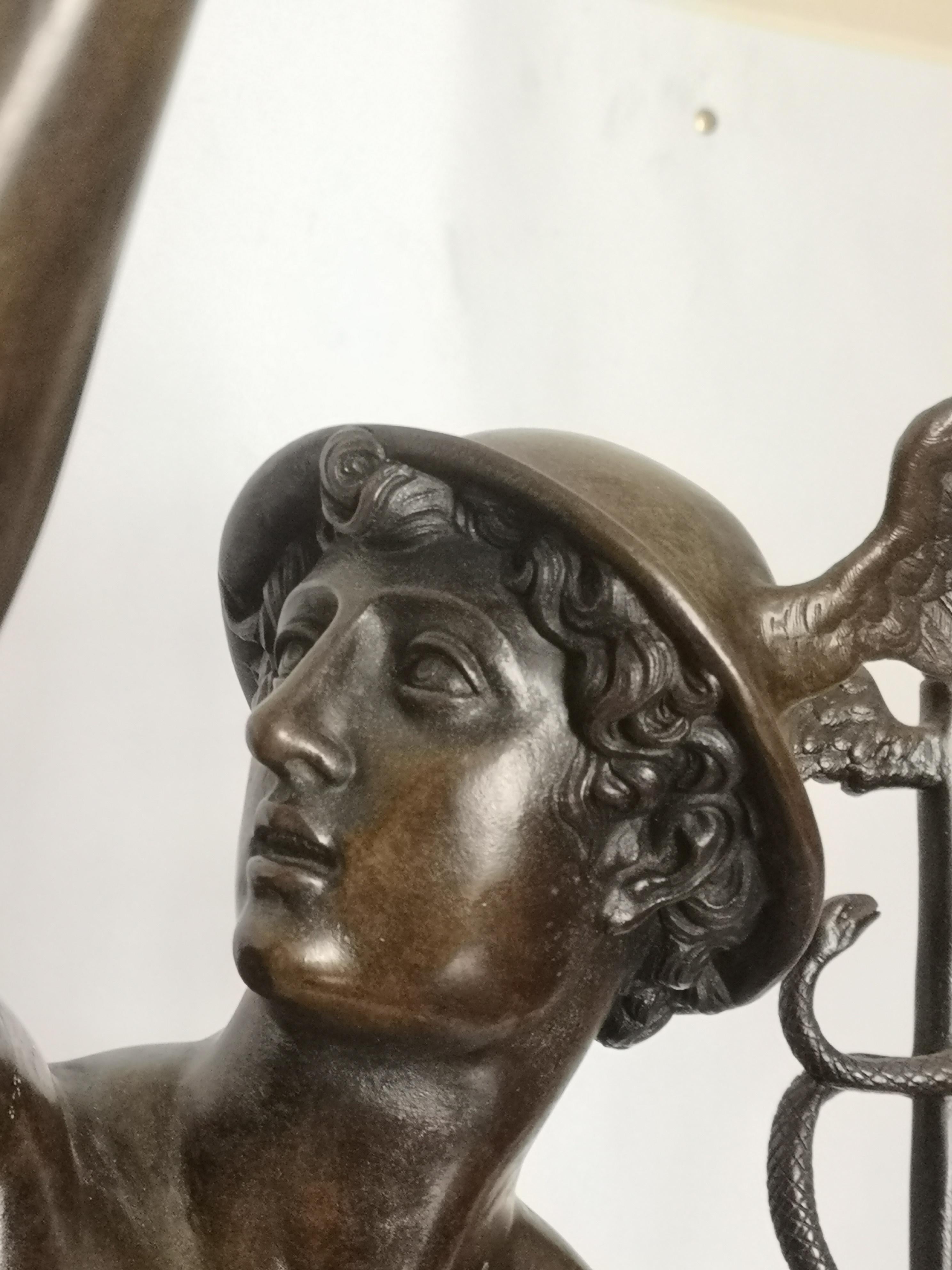 This large scale 19th century French bronze sculpture, modelled as the Greek God Mercury (Hermes in Roman), holding his sceptre with two entertwined snakes, flying above Boreas, the god of wind, blowing wind under his feet.
After Giambologna
