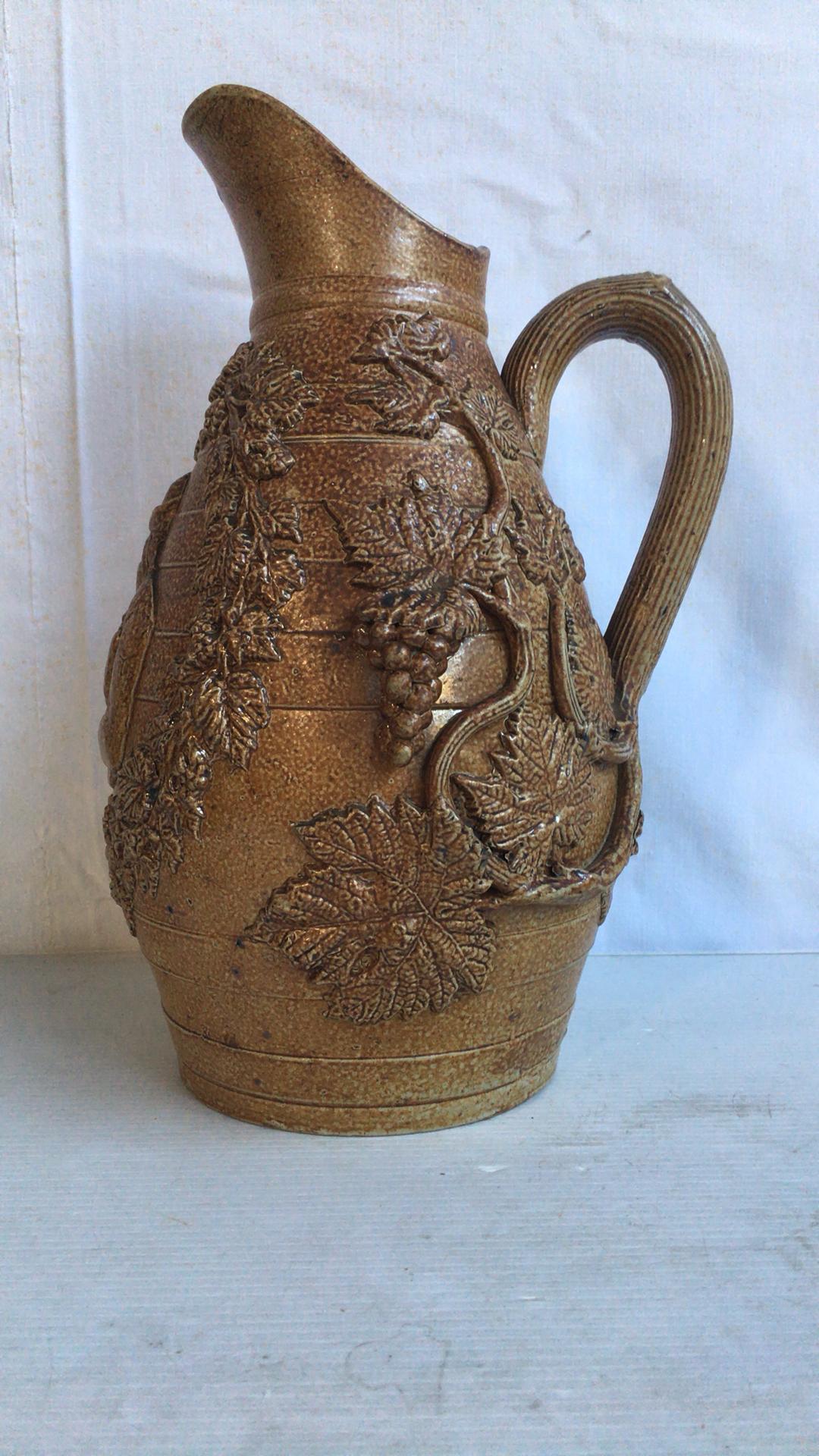 Large 19th century French pottery vine pitcher with grapes.
Pottery from Normandy.
 
