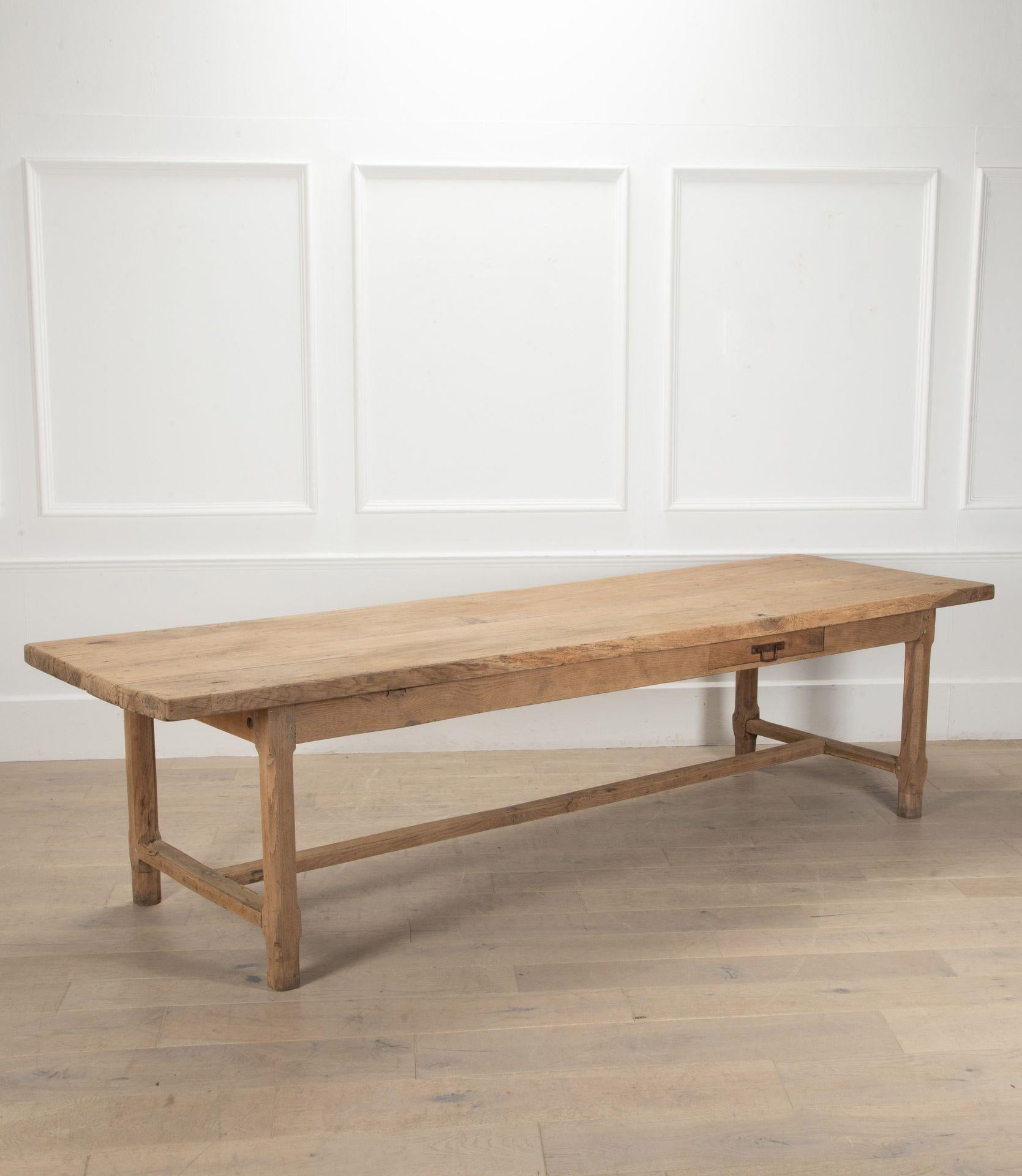 Stunning example of a large 19th Century French solid oak farmhouse table.
 Will seat 8-10 people. The legs have been tipped to make sure the table is the correct height. Has been washed and scrubbed to give it a contemporary feel.
Historic repairs