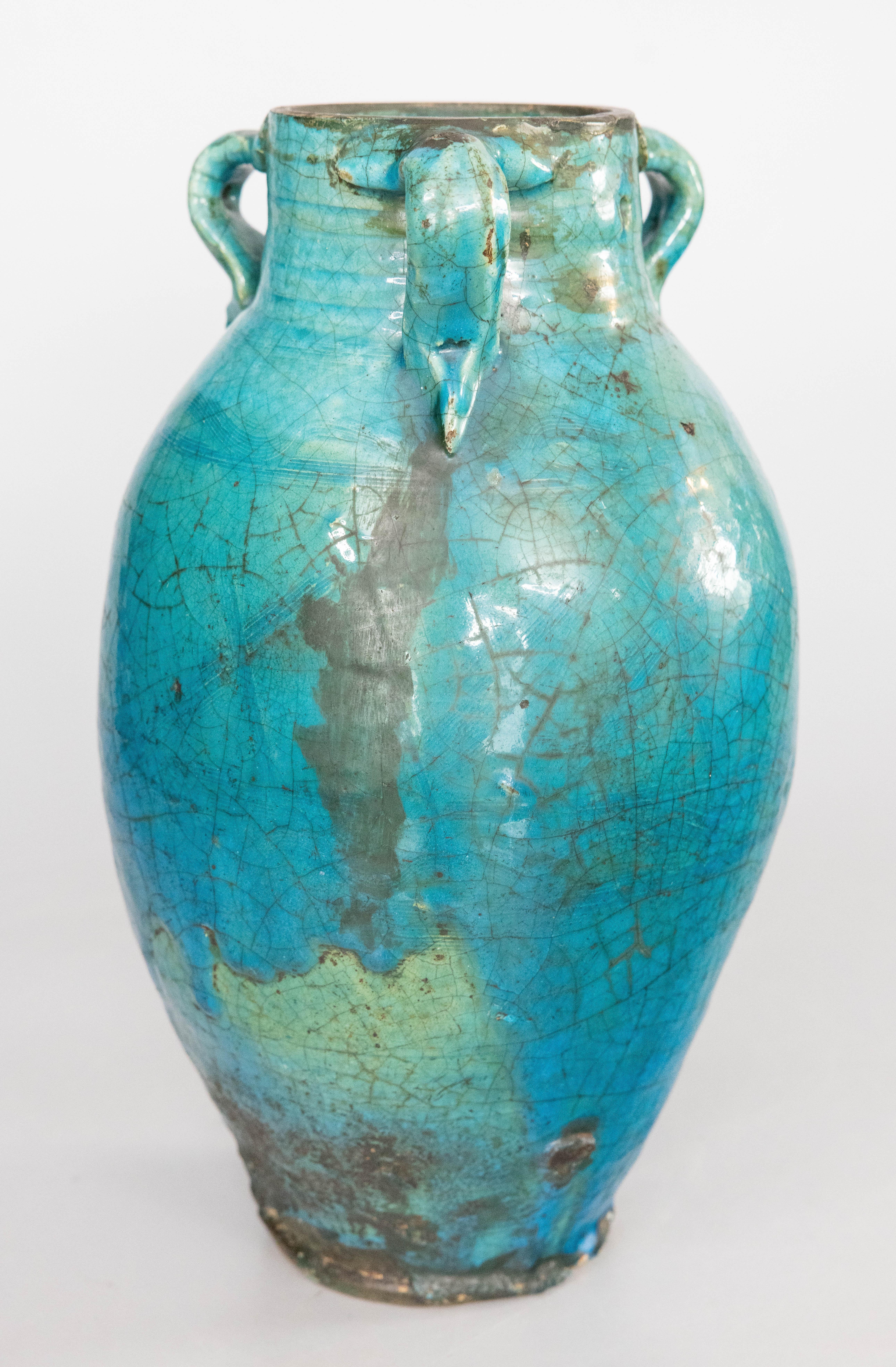 An exceptional antique French turquoise / teal / blue green glazed terracotta vase, urn, or olive jar with handles, circa 1850. This is the statement piece you've been looking for! This beautiful vase is a nice large size and heavy, weighing a