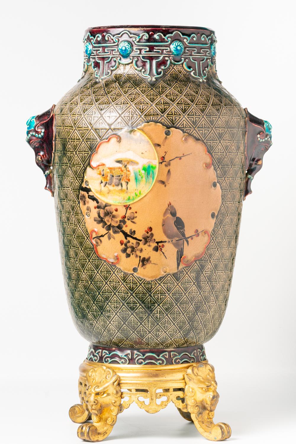 This scarce, impressive and large French vase was realised in Bordeaux by the worldwide renowned Jules Vieillard & Co and dated between 1880-1895 when the ceramic company's favourite designs and techniques were developed. This bulbous cylindrical