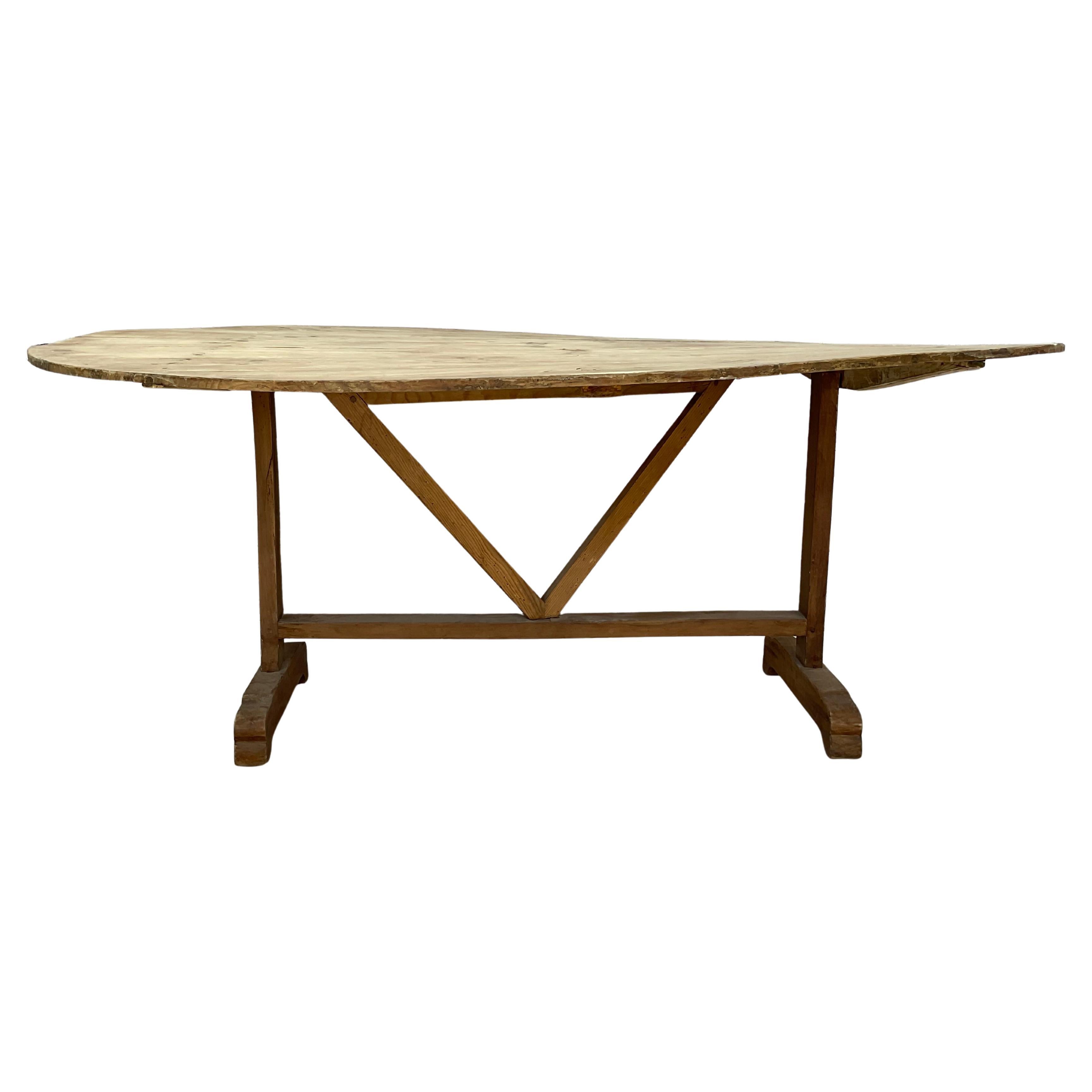 Unique 19th Century tilt-top wine tasting table. Top can be positioned vertically for storage and opened for use as a side or dining table. 
A rare find - this very unusually large wine tasting, or 'vendange' table, from a vineyard in the Bordeaux