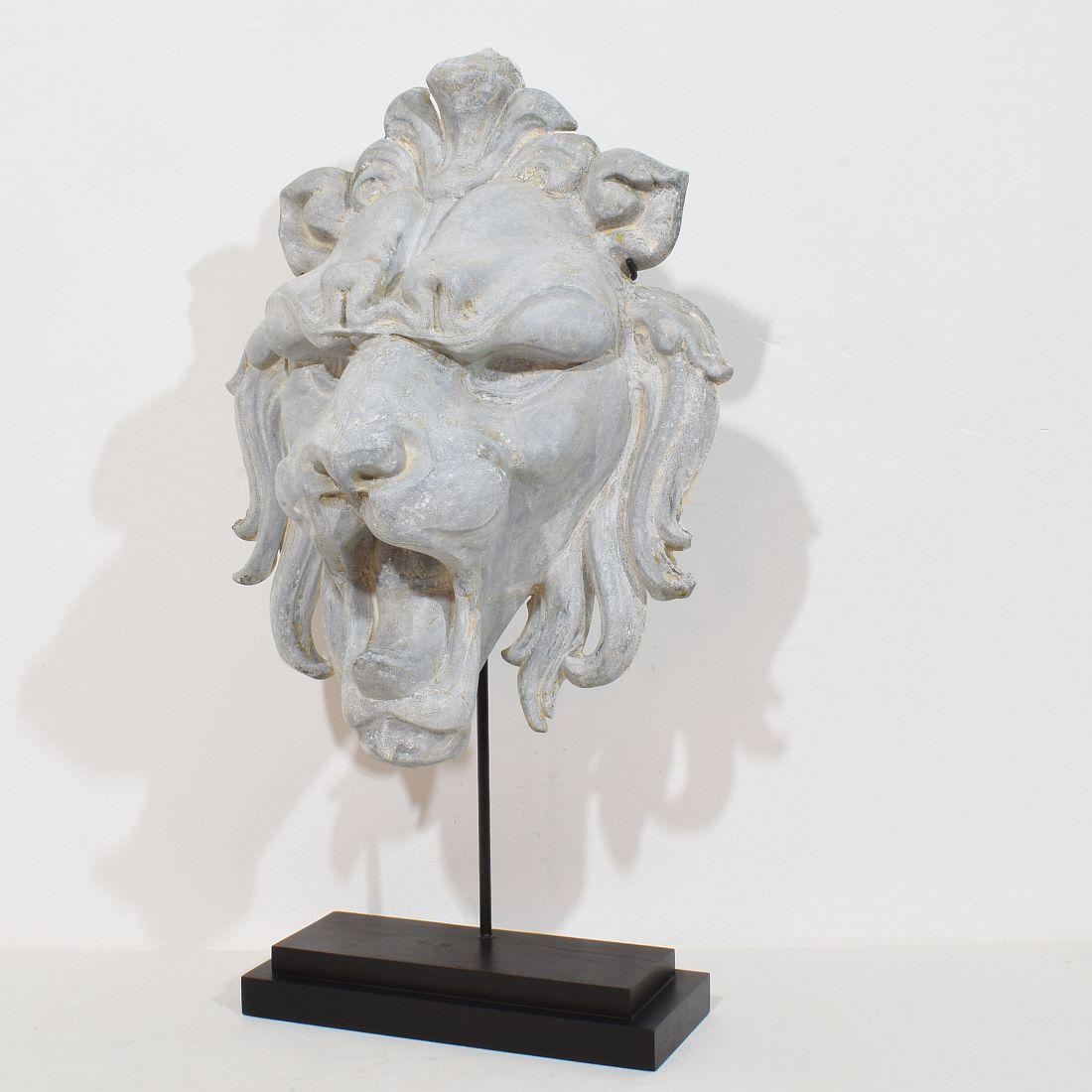 Beautiful and extremely rare large zinc lion head. Once part of a decoration of a facade. France, circa 1850-1900
Weathered and small losses but despite of its age in a good condition
Measurement here below is inclusive the wooden base.
Height