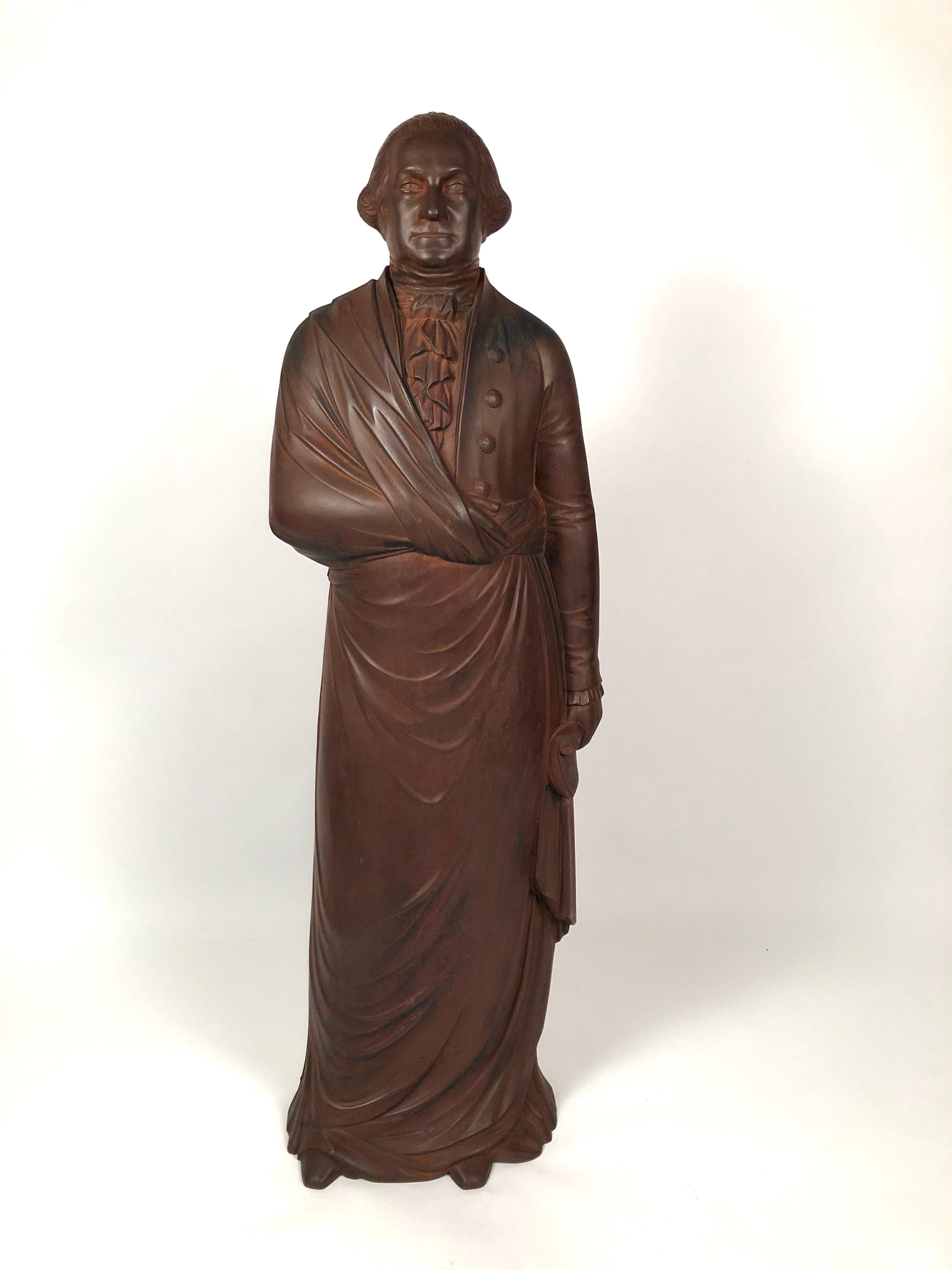 A striking 19th century cast iron figure of George Washington, the full-body figure composed of two joined halves with a well detailed head, body and robe details, the back inscribed in cursive, in the casting, 