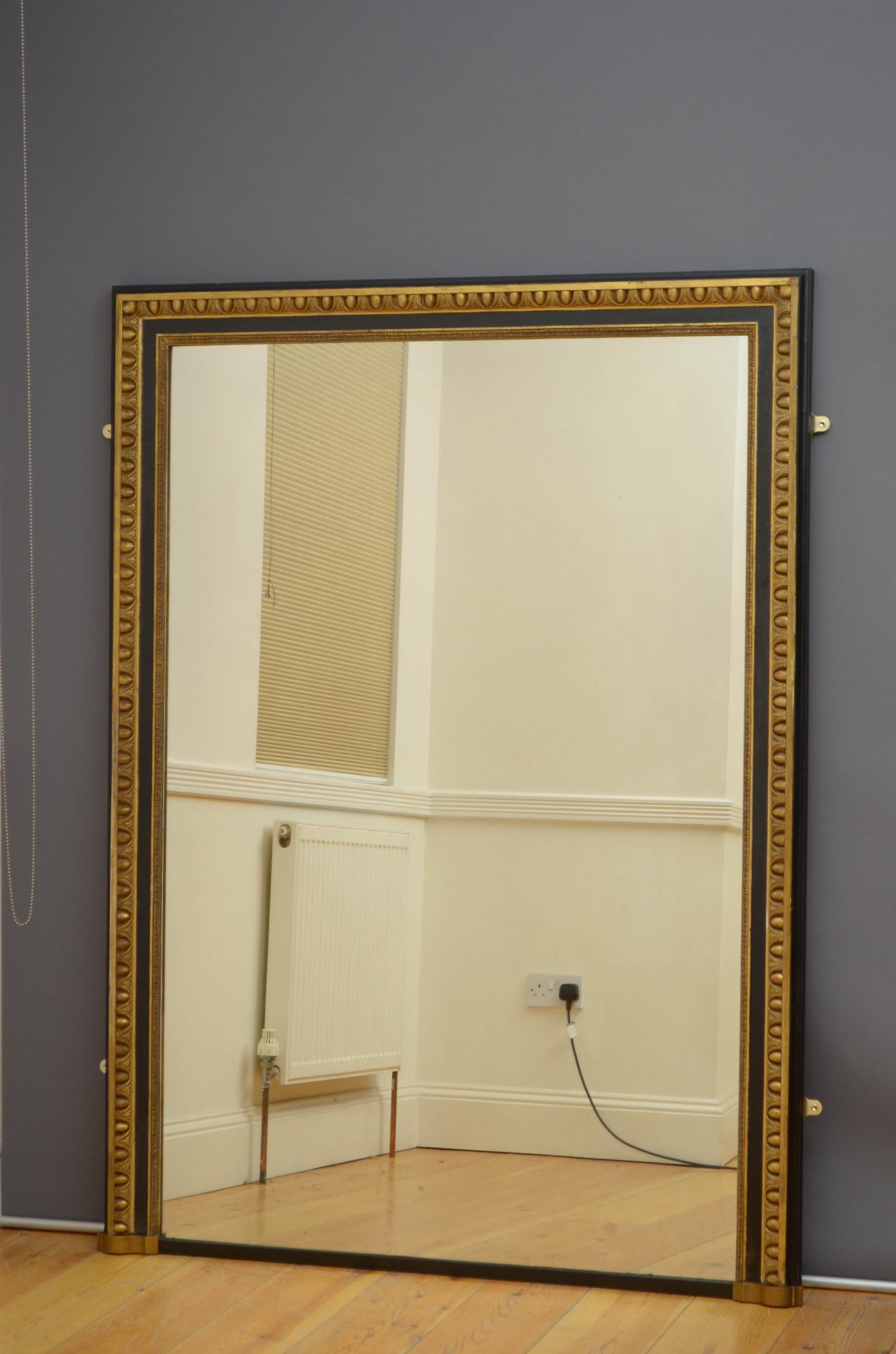 Sn5019, large XIXth century wall or a leaner mirror, having original glass with some imperfections in carved and moulded frame with egg and dart decorated edge. This mirror retains its original glass, original gilt and original panelled backboards,