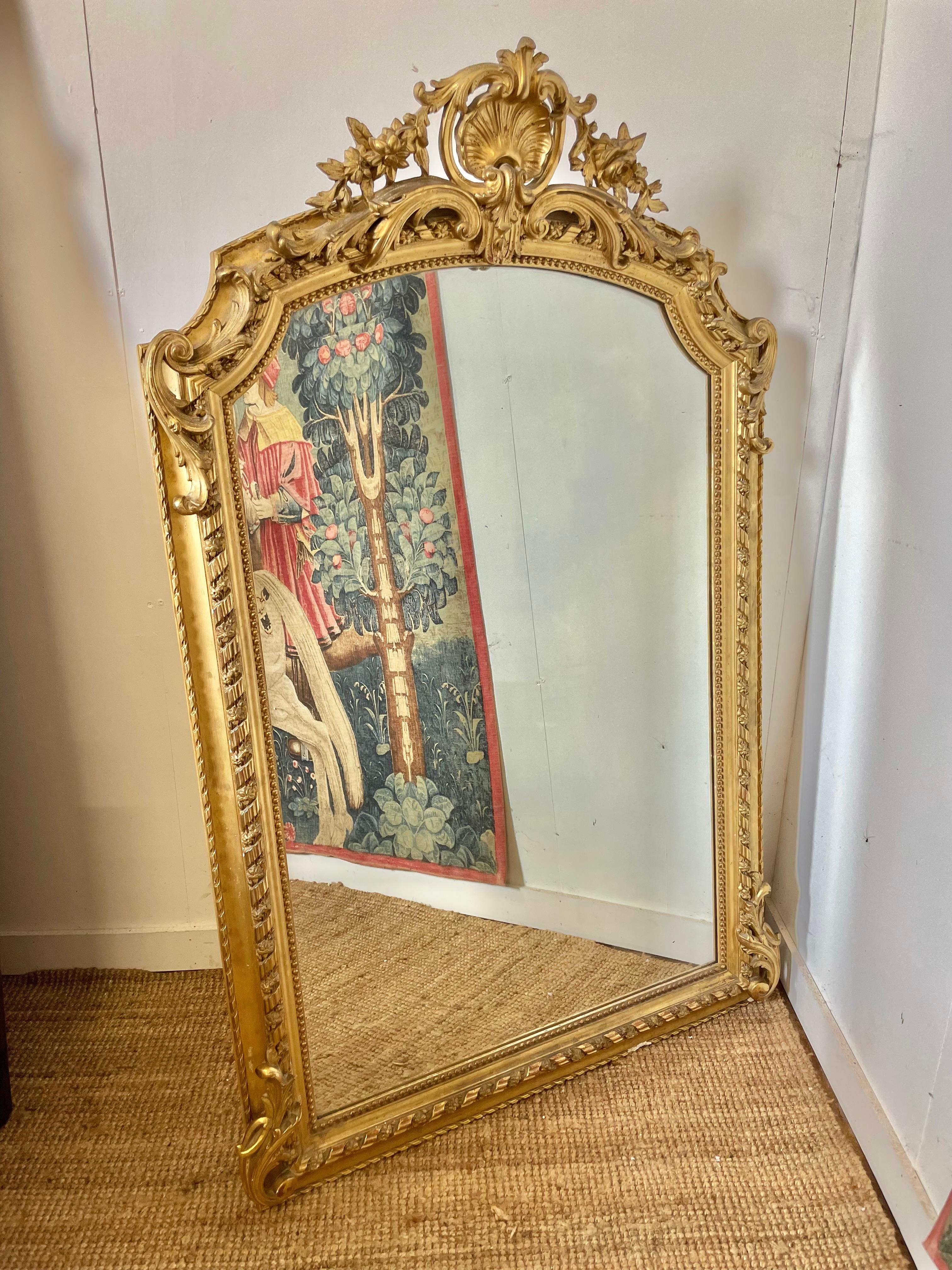 Fabulous 19th century gilded over mantle mirror , lovely shell motif to the cresting 

French circa 1870’s 

With original mirror and backboards 

41 inches X 65 inches 
104 x 165 cms
