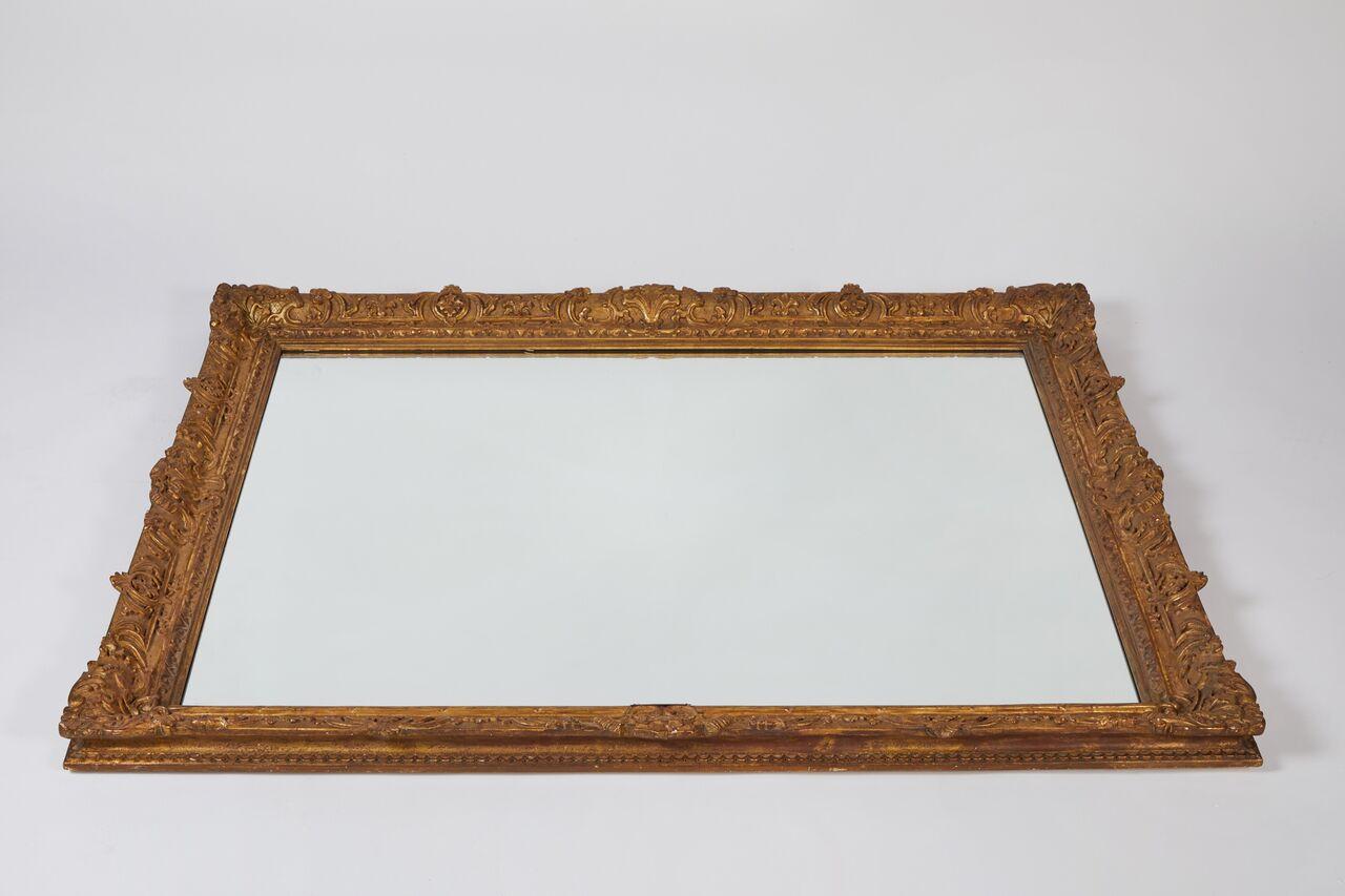 Large 19th century giltwood framed mirror. 
This mirror would be beautiful placed above a commode. 

Plate from later date.