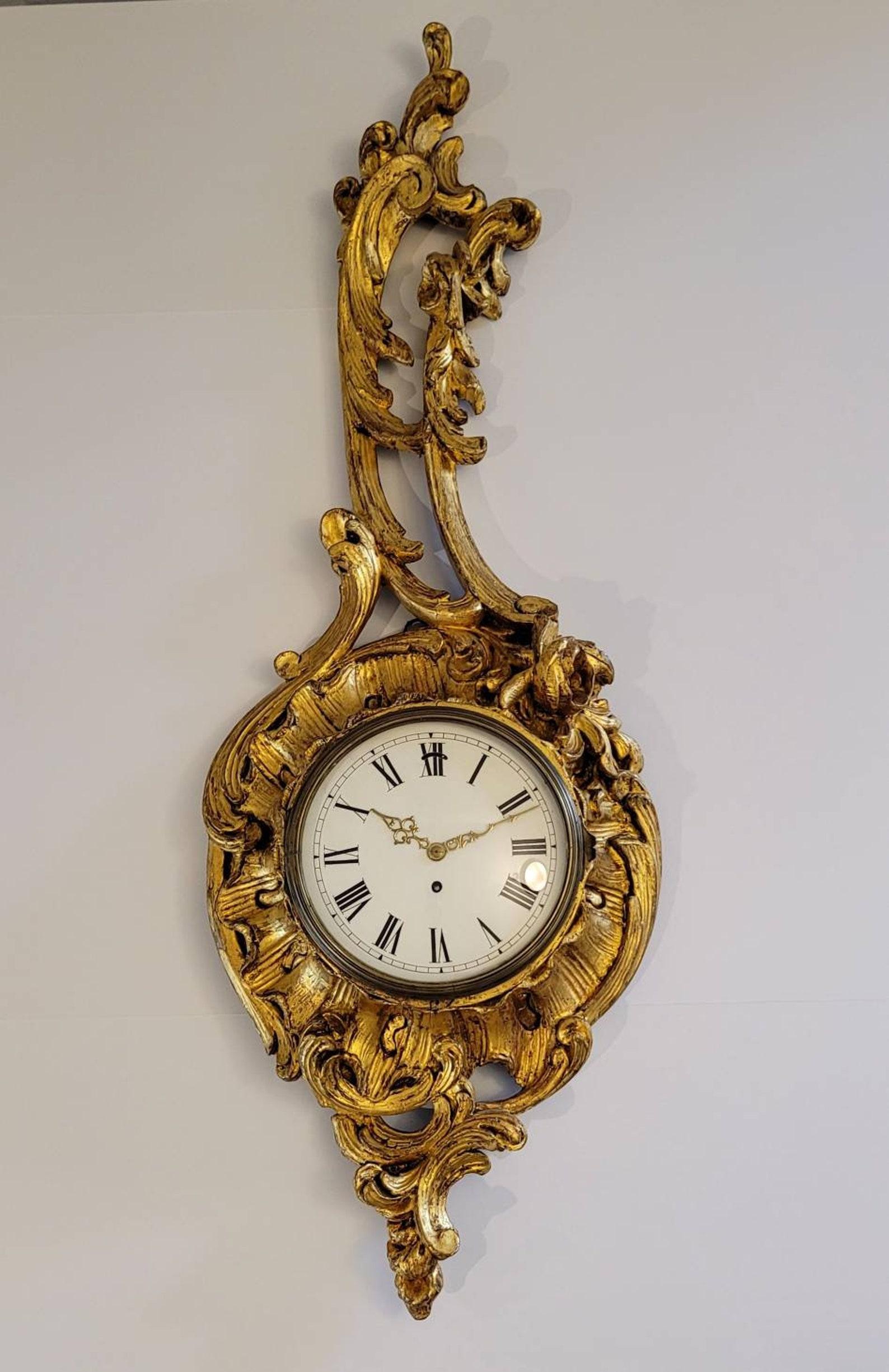 A stunning and most impressive large size antique French cartel clock. 

Exquisitely hand-crafted in France in the 19th century, very fine quality hand carved and rich brilliantly gilded wood case, exceptionally executed classical Louis XV style,