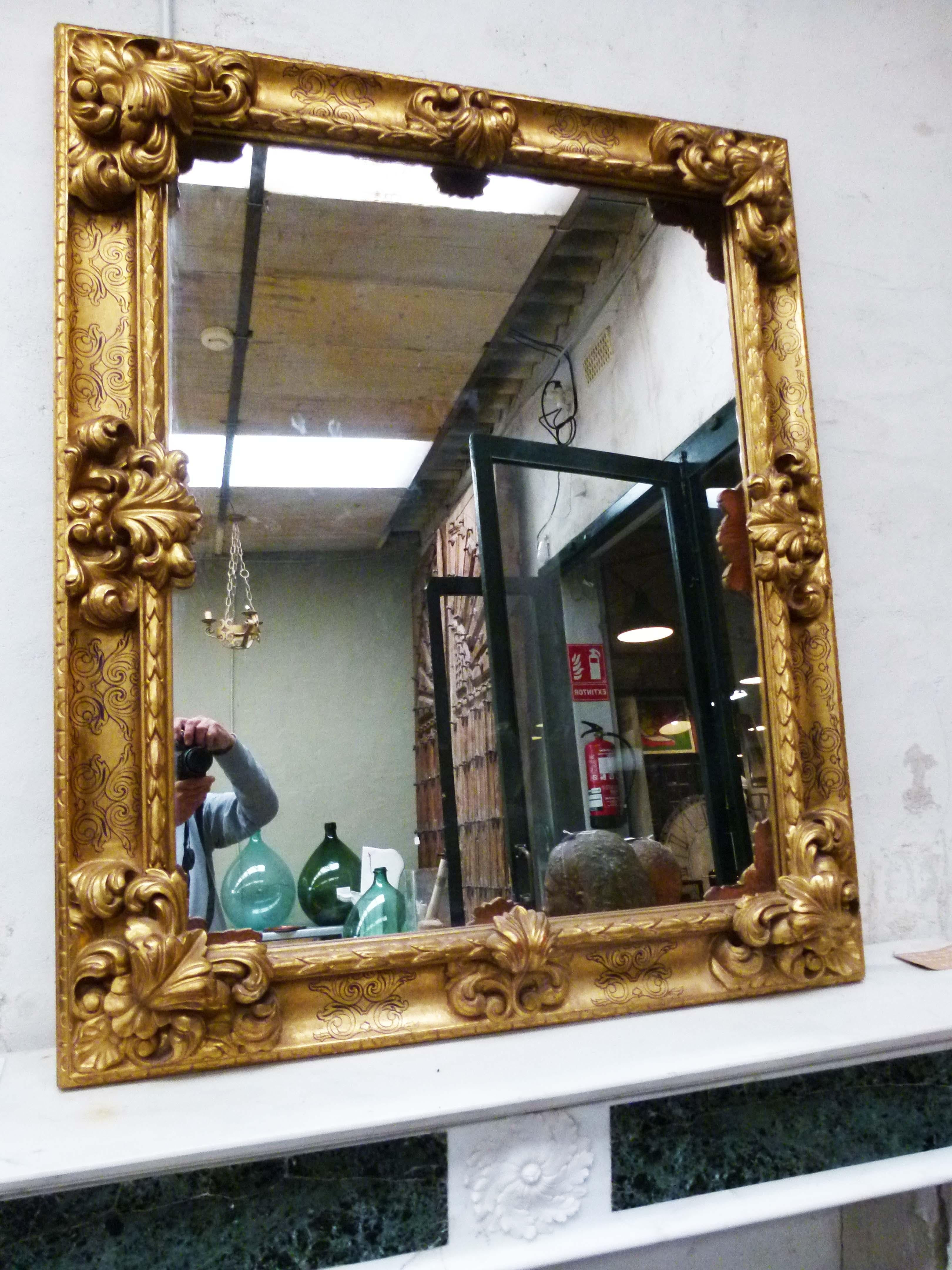 Large giltwood mirror with leaf hand carved decorations in style of Louis XY revival.
 
  
