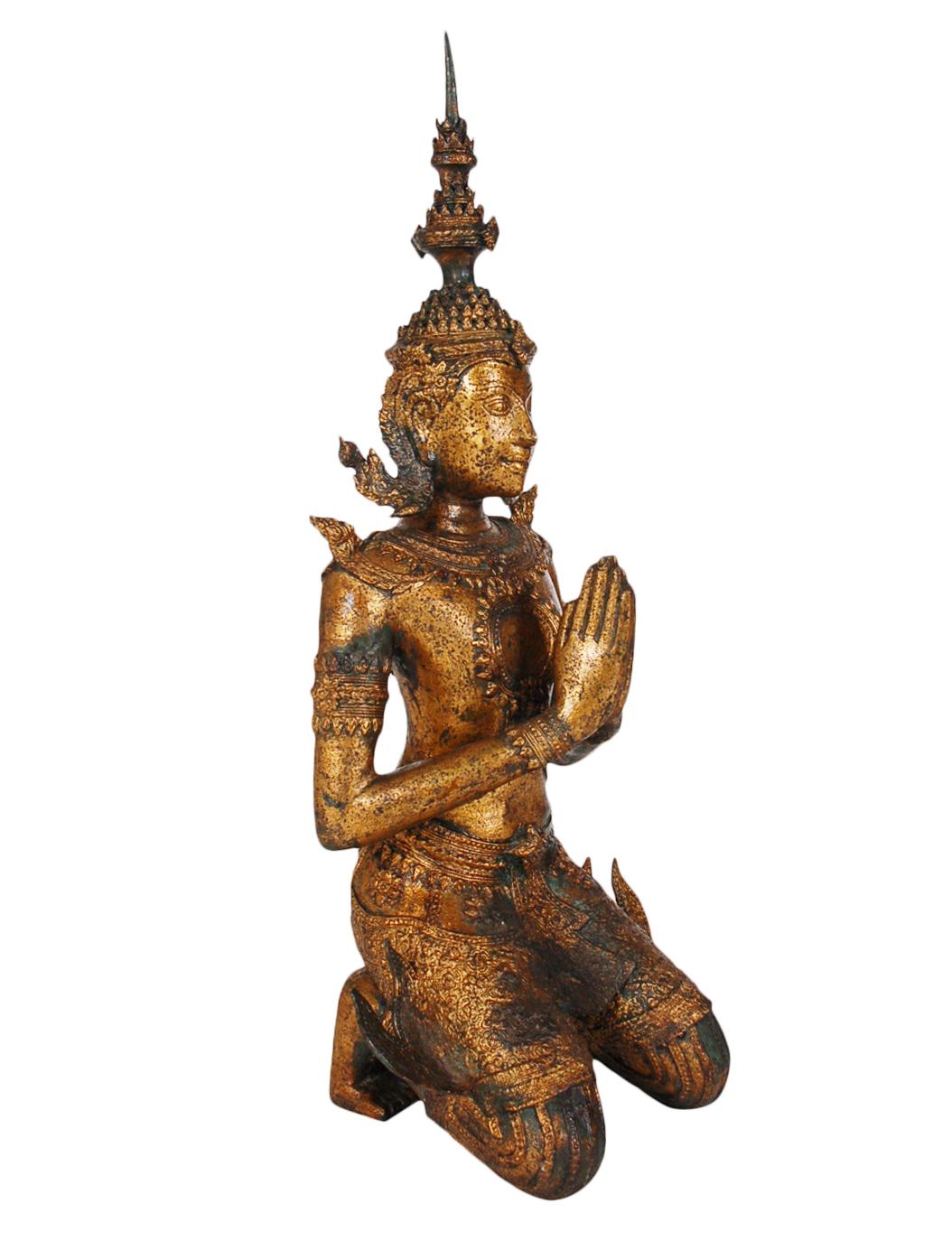 A large and extremely heavy solid bronze Thepenom Thai Angel Statue from the early 1900s. This subject is a male form protector Angel. It still has much of its original gold gilt finish. A beautiful example circa 100 years old. Warm rich patina and