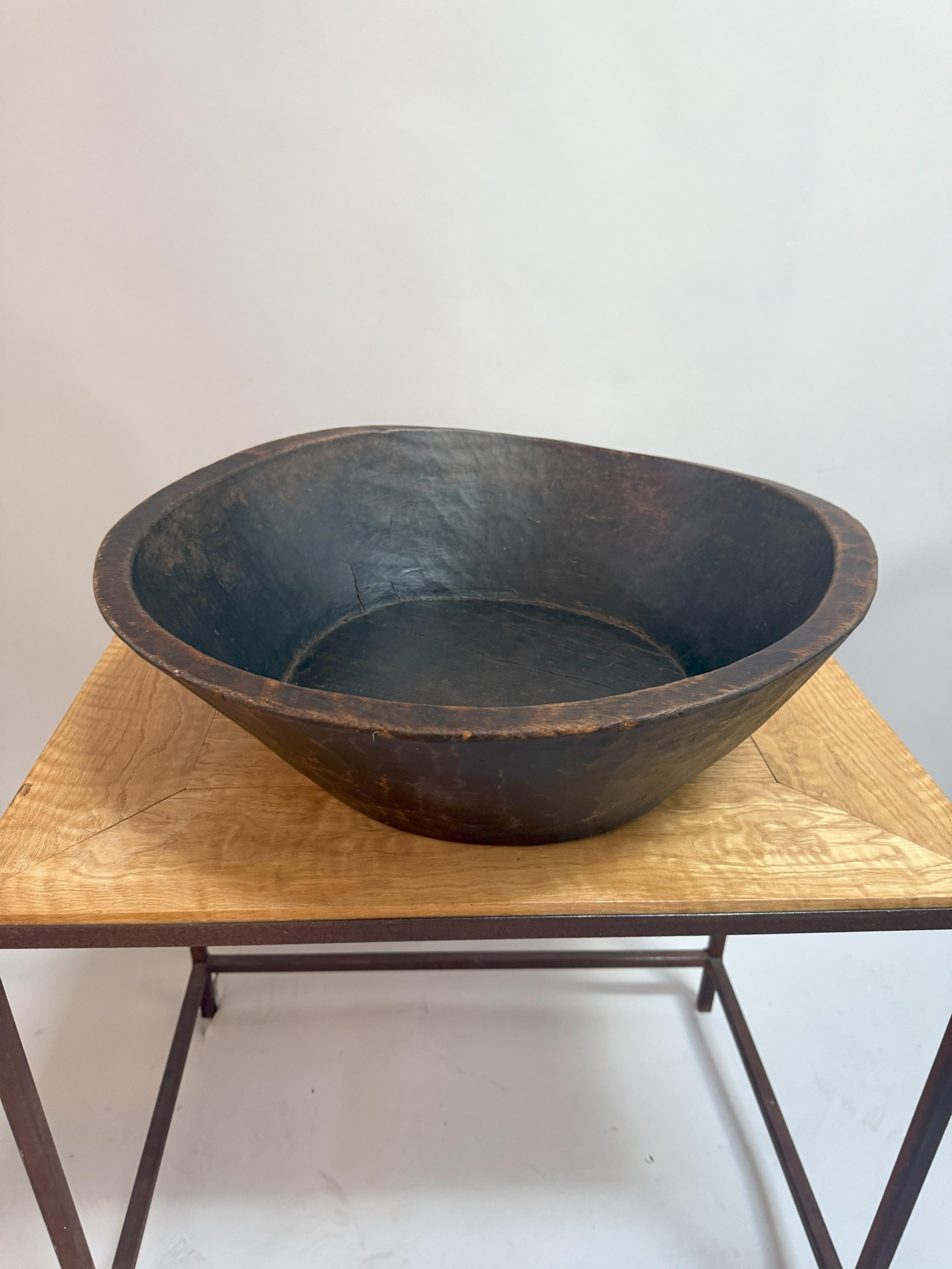 This beautifully weathered wooden basin was hand-carved from a single piece of chestnut around 1850 in the Basque region of France. With its bold, sculptural shape and deep, rich patina, it brings instant rustic character to any space!

You'll love