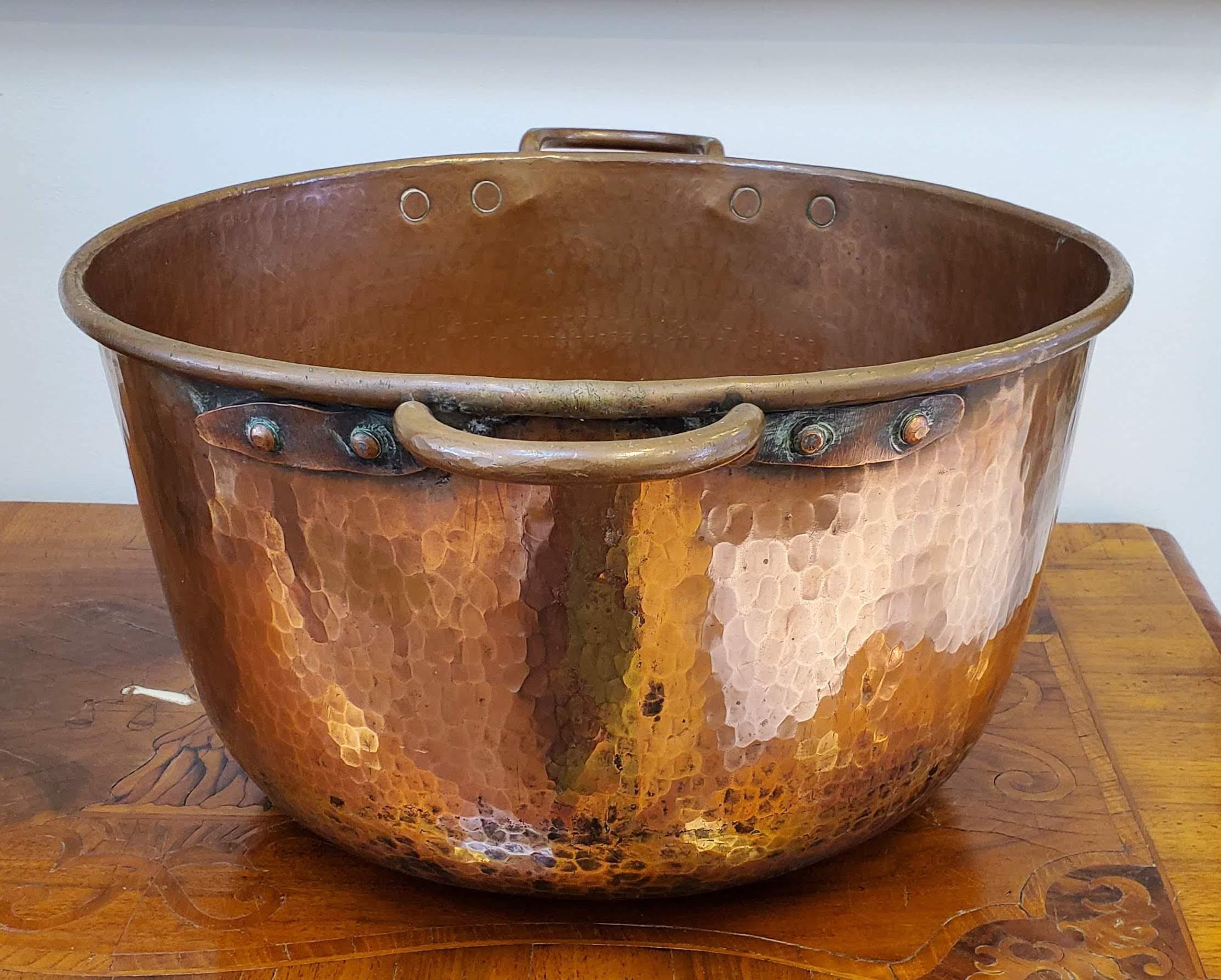 Unusually large copper pot. Great size with two sturdy riveted handles and old patinated hand hammered surface. North Africa, circa 1860.
Measures: 10” H, 17” Dia
 