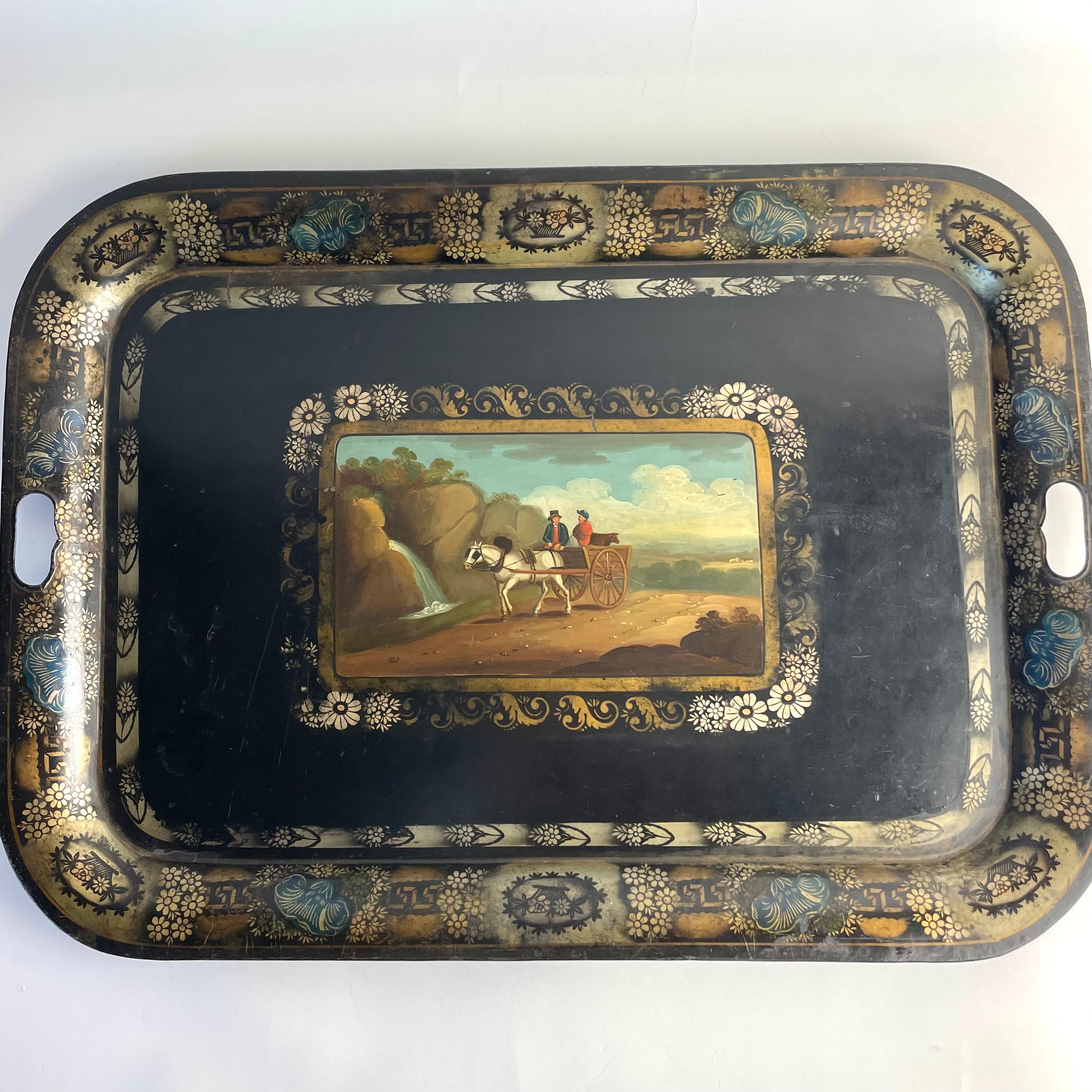 
Large 19th Century Hand-Painted Tôle Tray with Naïve Scene and Floral Details

Charming and decorative large tole tray from the mid-19th century, featuring a hand-painted central scene of a horse and cart with two figures in a rural landscape. The