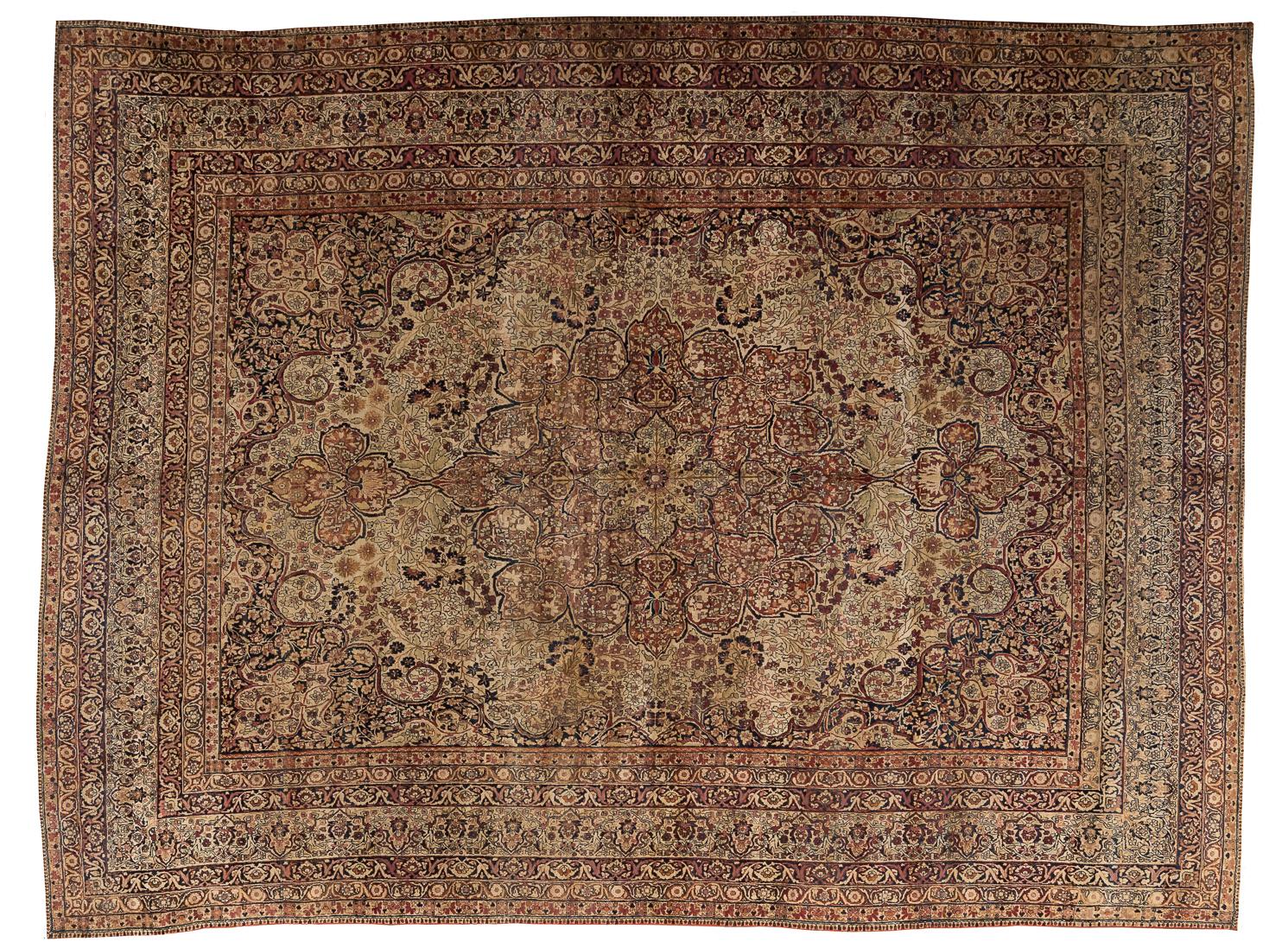 This 19th-century Kerman Lavar carpet stands as an extraordinary example of finely detailed workshop weaving, celebrated for its harmony of colour, balance, and intricacy. Its expansive field is arranged around a beautifully articulated central