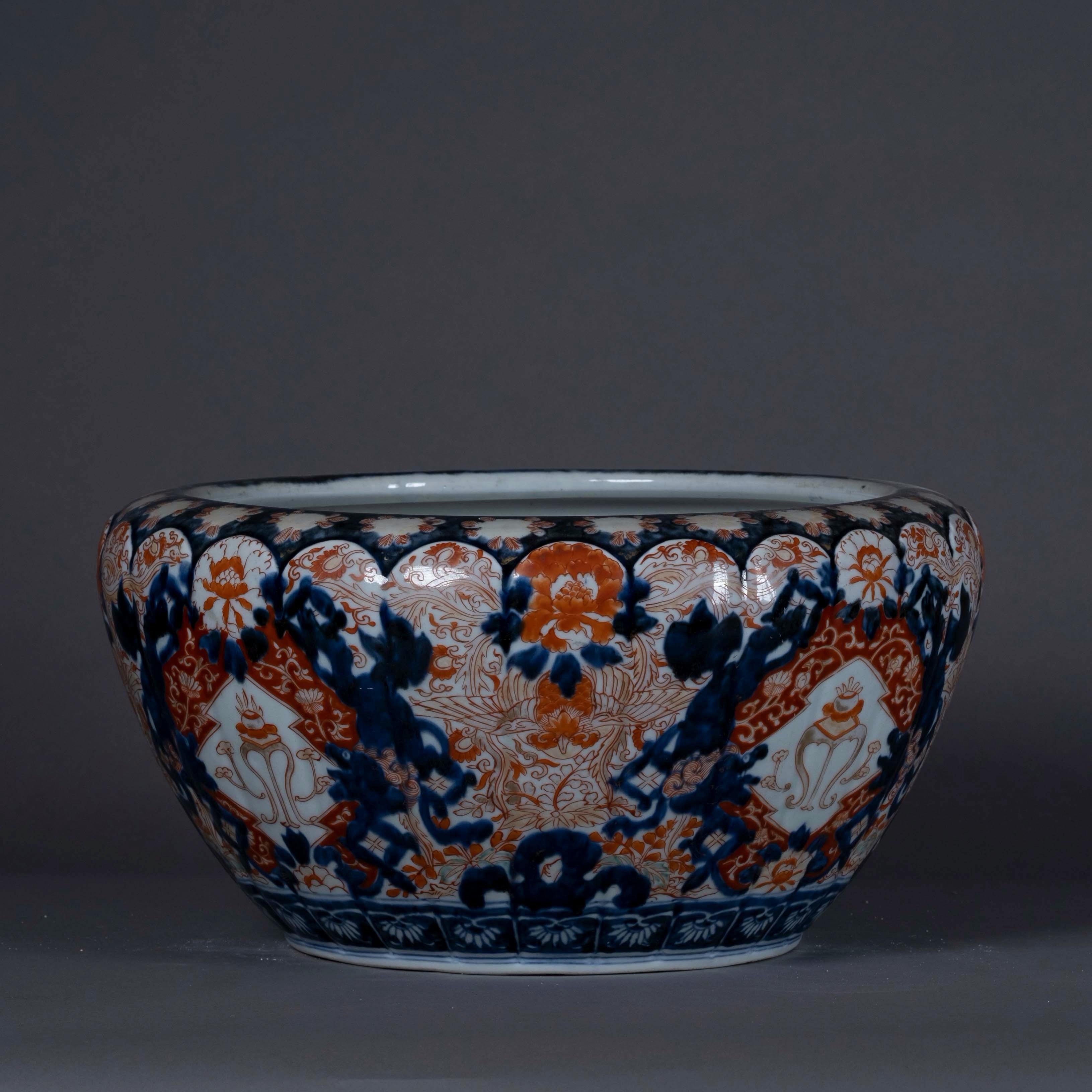 A large 19th century Imari Porcelain bowl, decorated in the traditional manner with foliage and flowers in red, blue and gilt glazes.