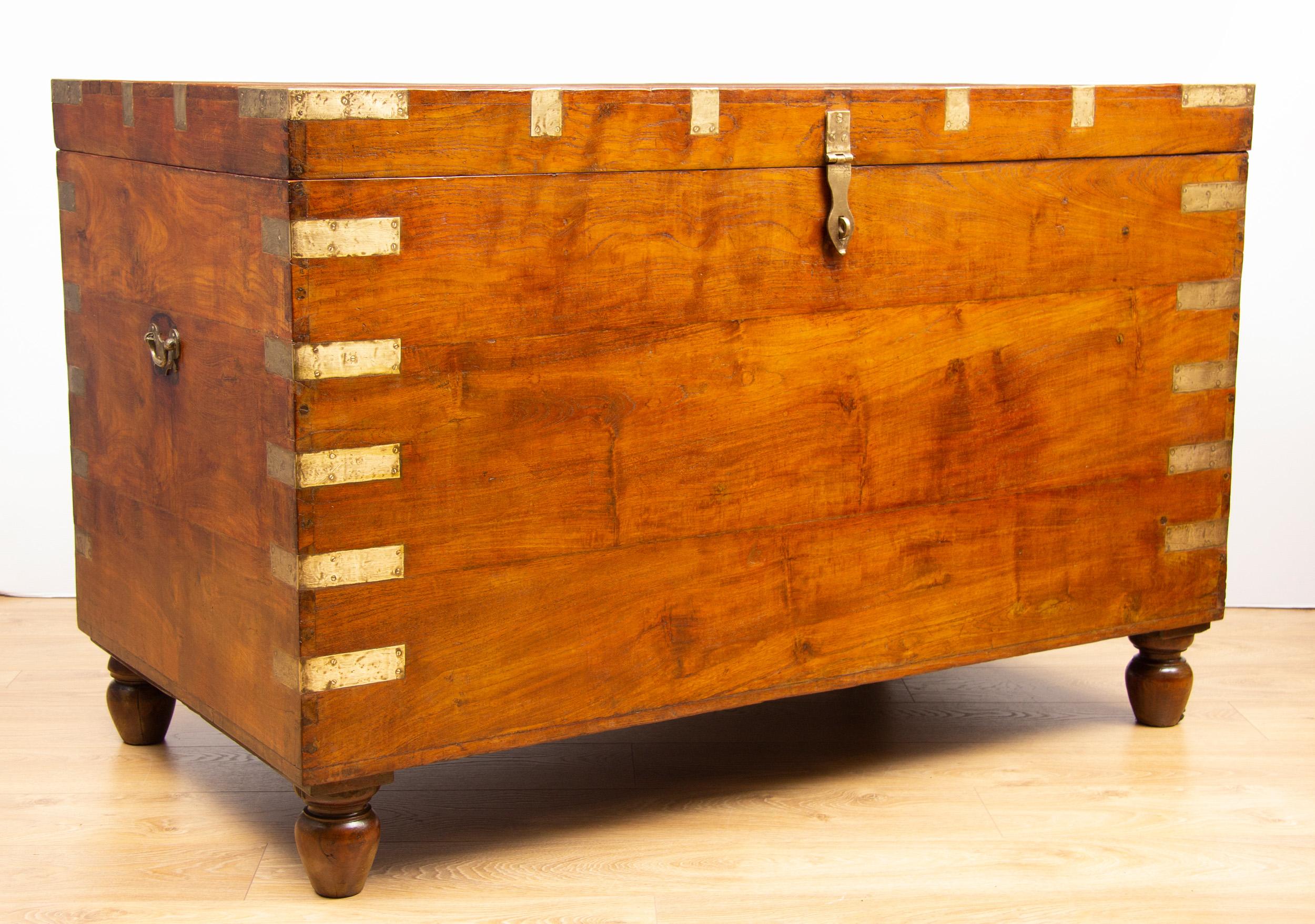 Large 19th century Indian teak chest.
The biggest we have ever seen! 

This massive brass bound trunk sits on four turned legs
The ultimate antique storage option, this could fit enough blankets and sheets for a small hotel.