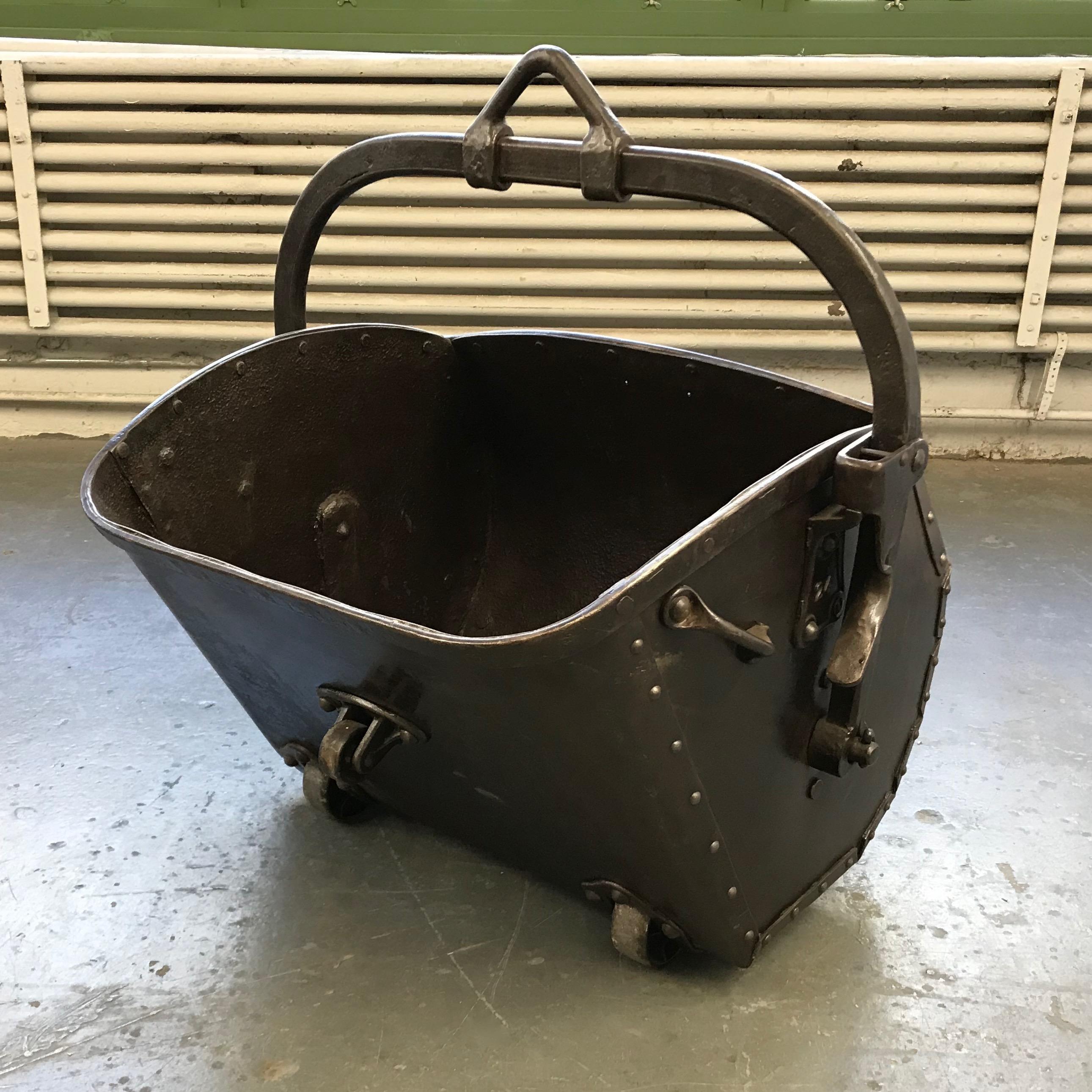 Large, late 19th century, early industrial age, coal, drag shovel bucket features a newly re-surfaced and sealed, steel body with rivets and wrought iron hardware. This is highly unique, truly impressive vessel can be used for a multitude of