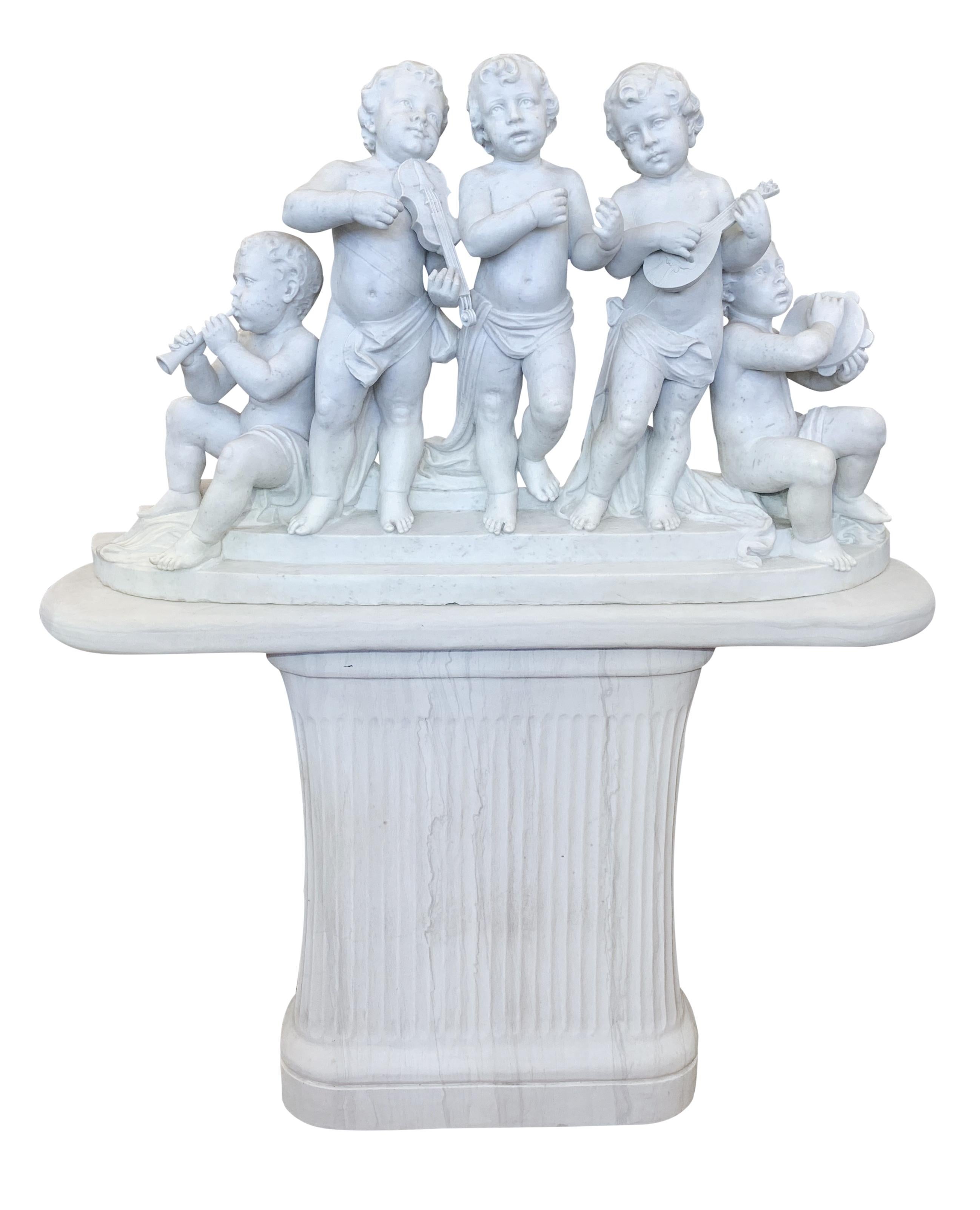 A large and finely carved 19th century Italian white marble musical group. This lovely group depicting five Bacchic putti musicians playing various musical instruments. Four of them playing trumpet, mandolin, tambourine, violin and one singer. Three