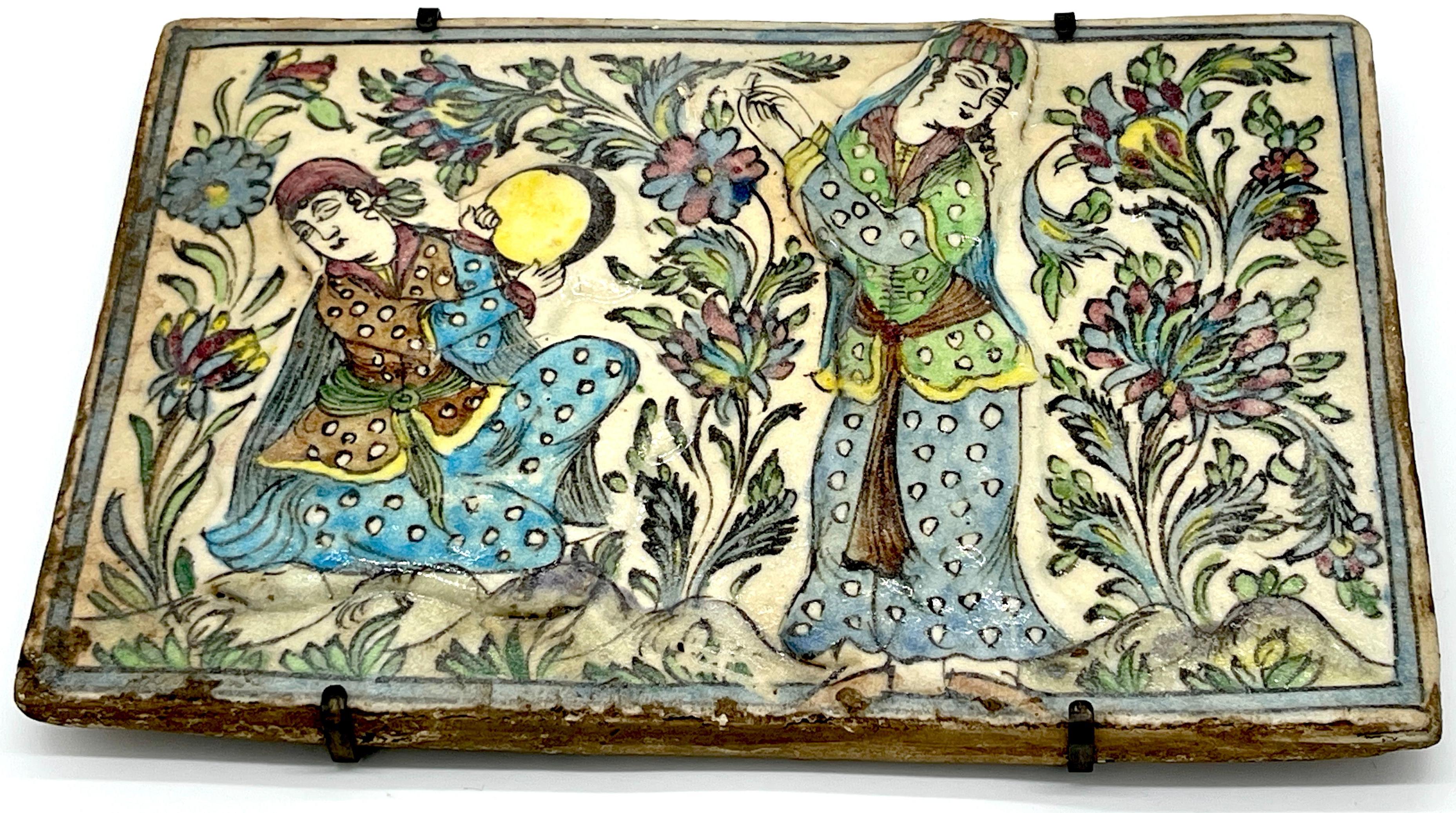Large 19th-century Iznik pottery pictorial tile 'Maidens in Garden'
Asia, a 19th-century or older example 

A captivating large example from the 19th century, this Iznik pottery pictorial tile titled 'Maidens in Garden' from Asia, Measuring 14.5