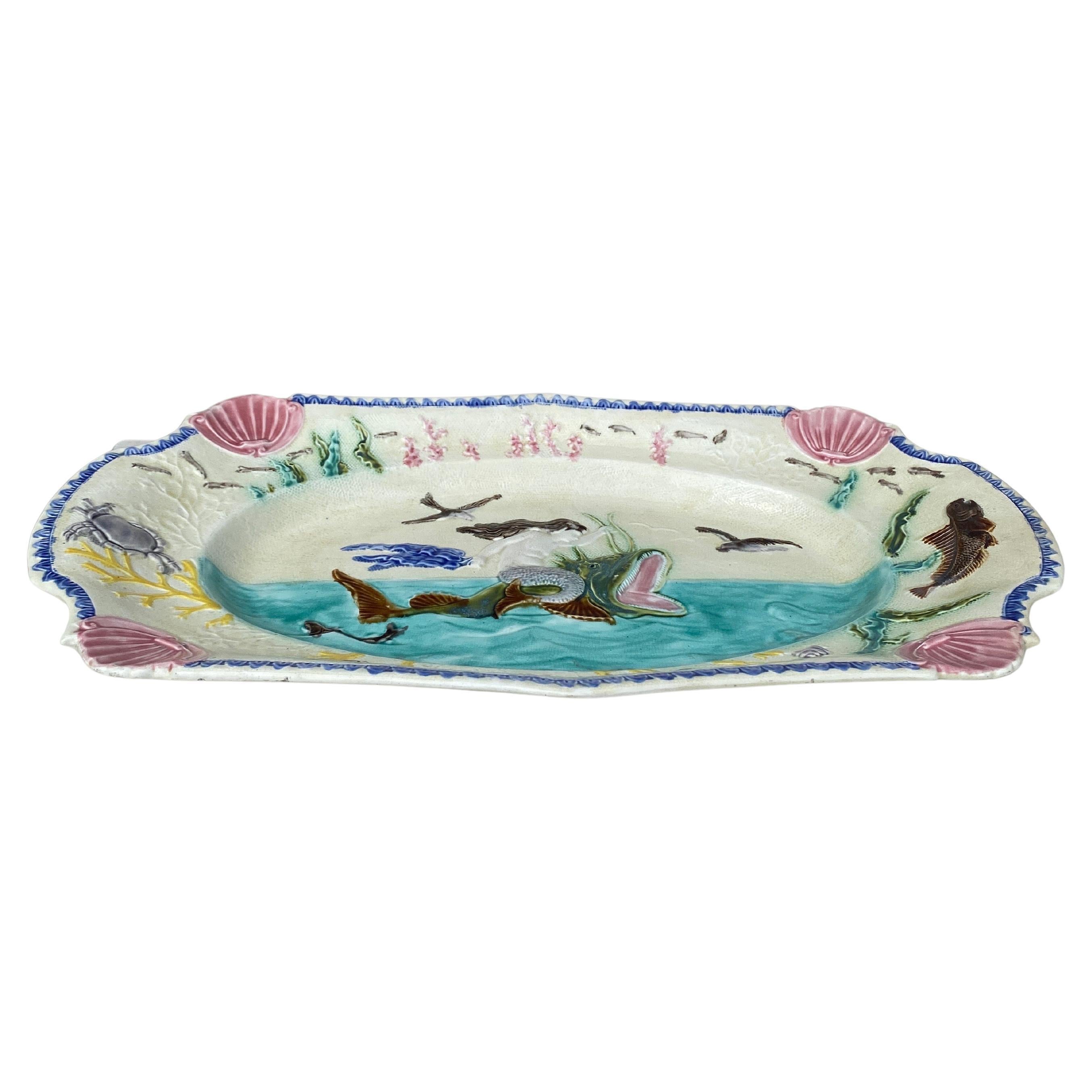 Large 19th Century Belgium Majolica Mermaid Wall Platter signed Mouzin Lecat Nimy Les Mons.
20.8 by 11.8 inches. the mermaid sit on a large fish, the border is decorated with shrimps seaweeds,shells,crab and a fish circa 1880.