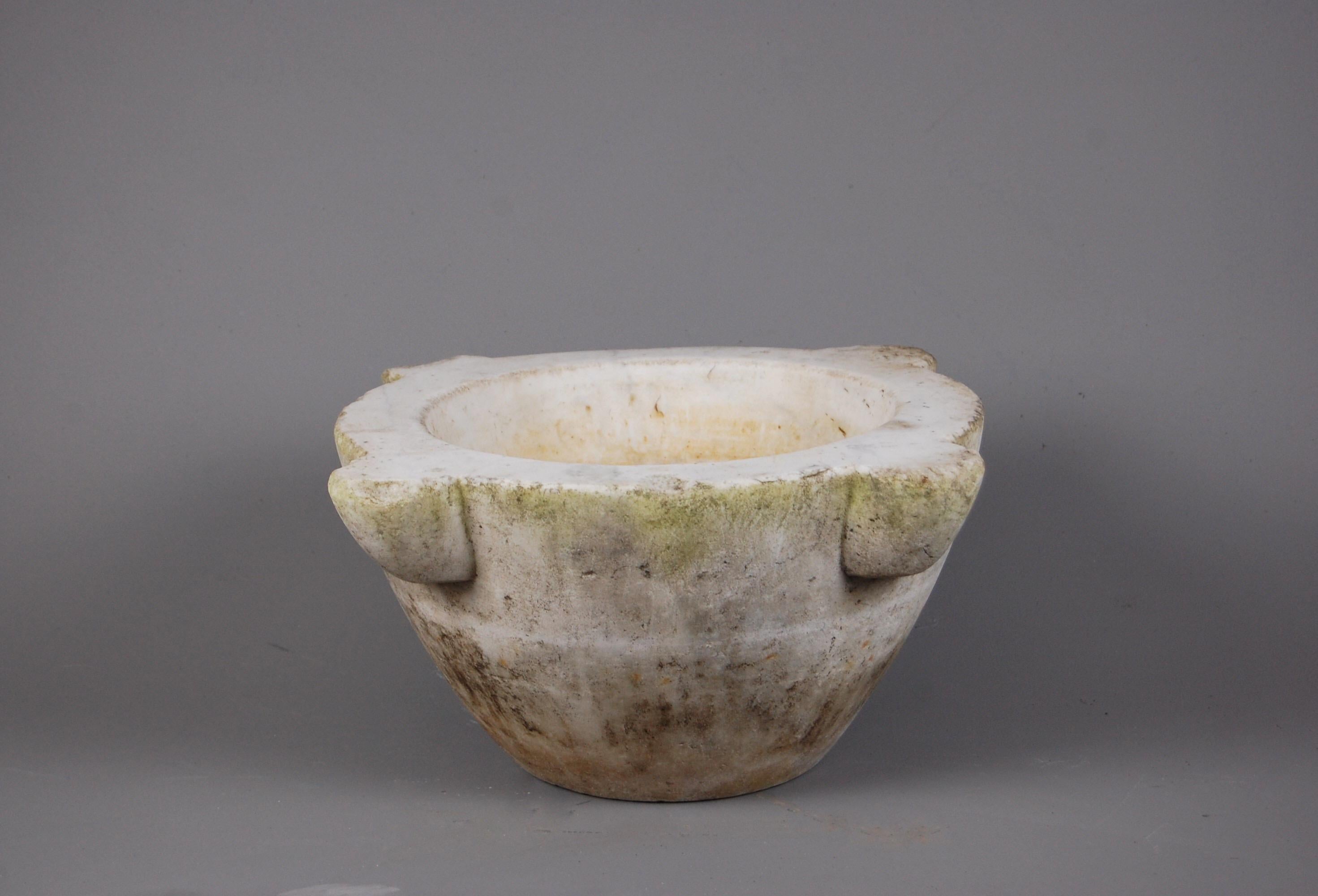 19th century Apothecary mortar in marble, expected wear and use, with minor chips and losses throughout. A nice large scale example, lightly weathered, ideal for interior or exterior use.