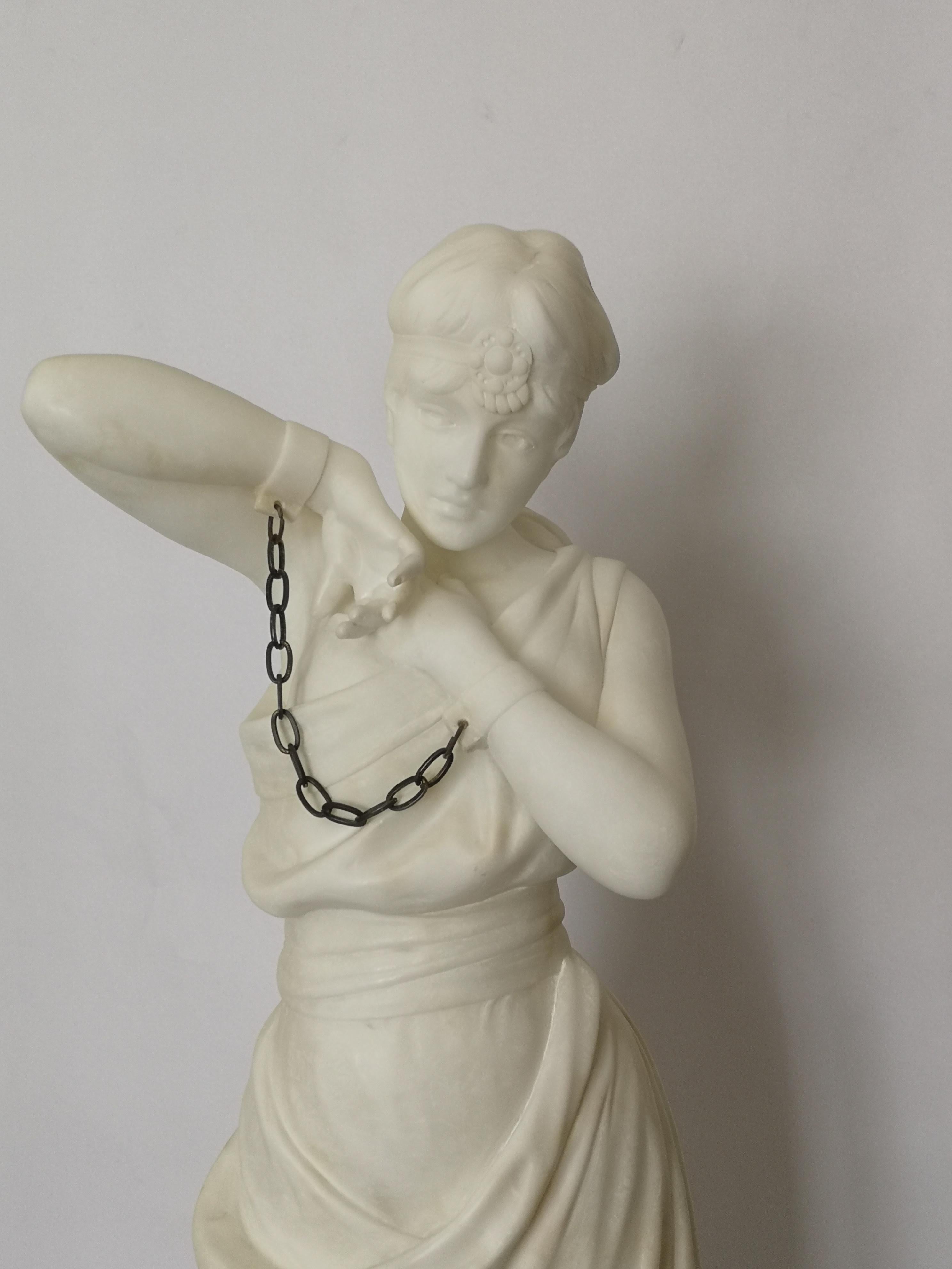 A good sized late 19th century marble sculpture, of a full length woman dressed in a robe, her hands shackled together in bronze chains. Standing on a two stepped base and signed 'Pugi'
Italian, circa 1890.