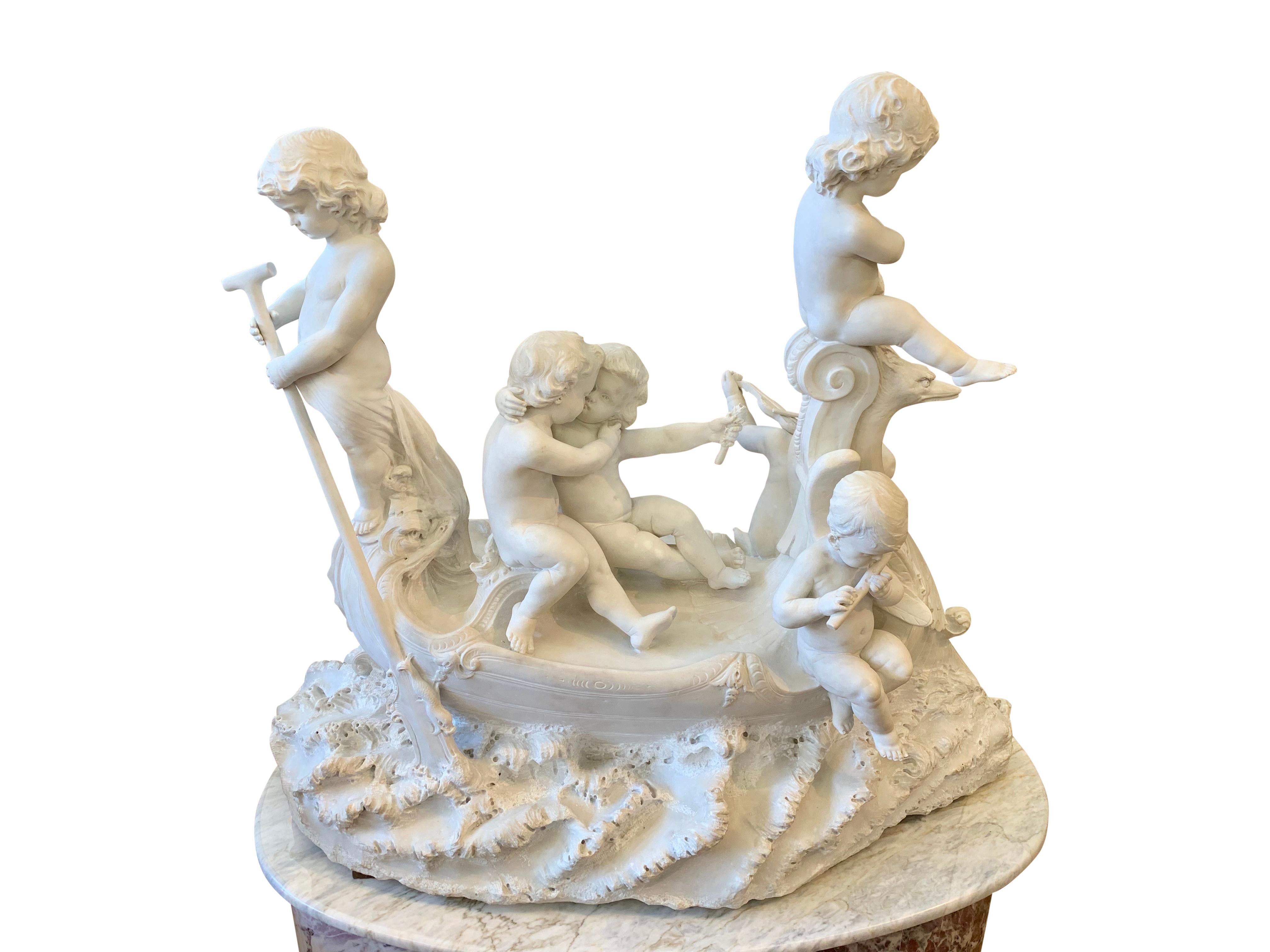 This charming 19th century Italian carved white Carrara marble group depicts six children in a boat. Three children playing musical instruments (violin, flute and angel harp), one cherub rows the swan shaped boat, and two other embracing while one
