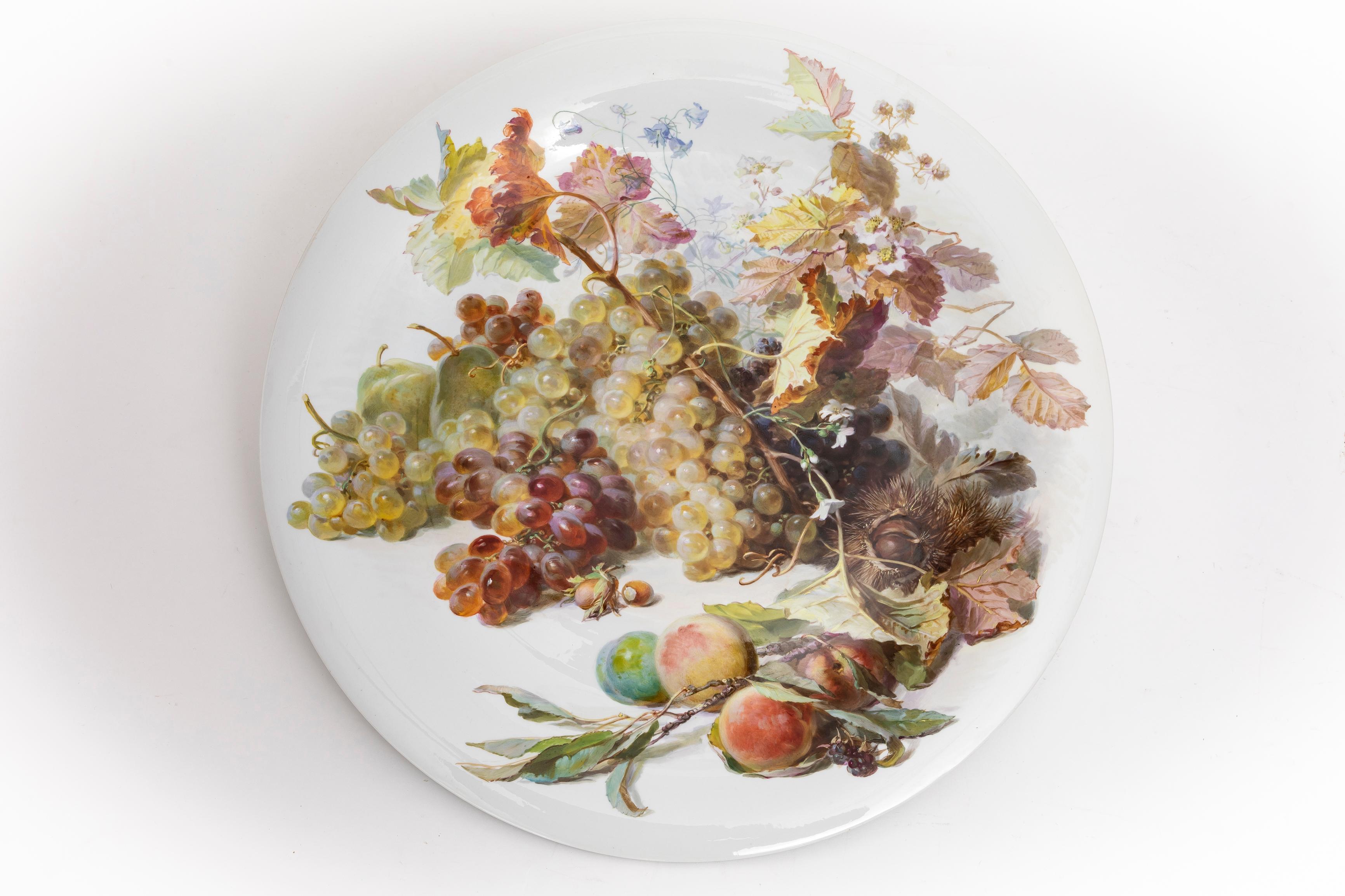 An Incredible and Large 19th Century Meissen Porcelain Still Life Decorated Charger, By Julius Eduard Braunsdorf.  This remarkable charger stands as a testament to the artistic mastery and precision craftsmanship that defined the renowned Meissen