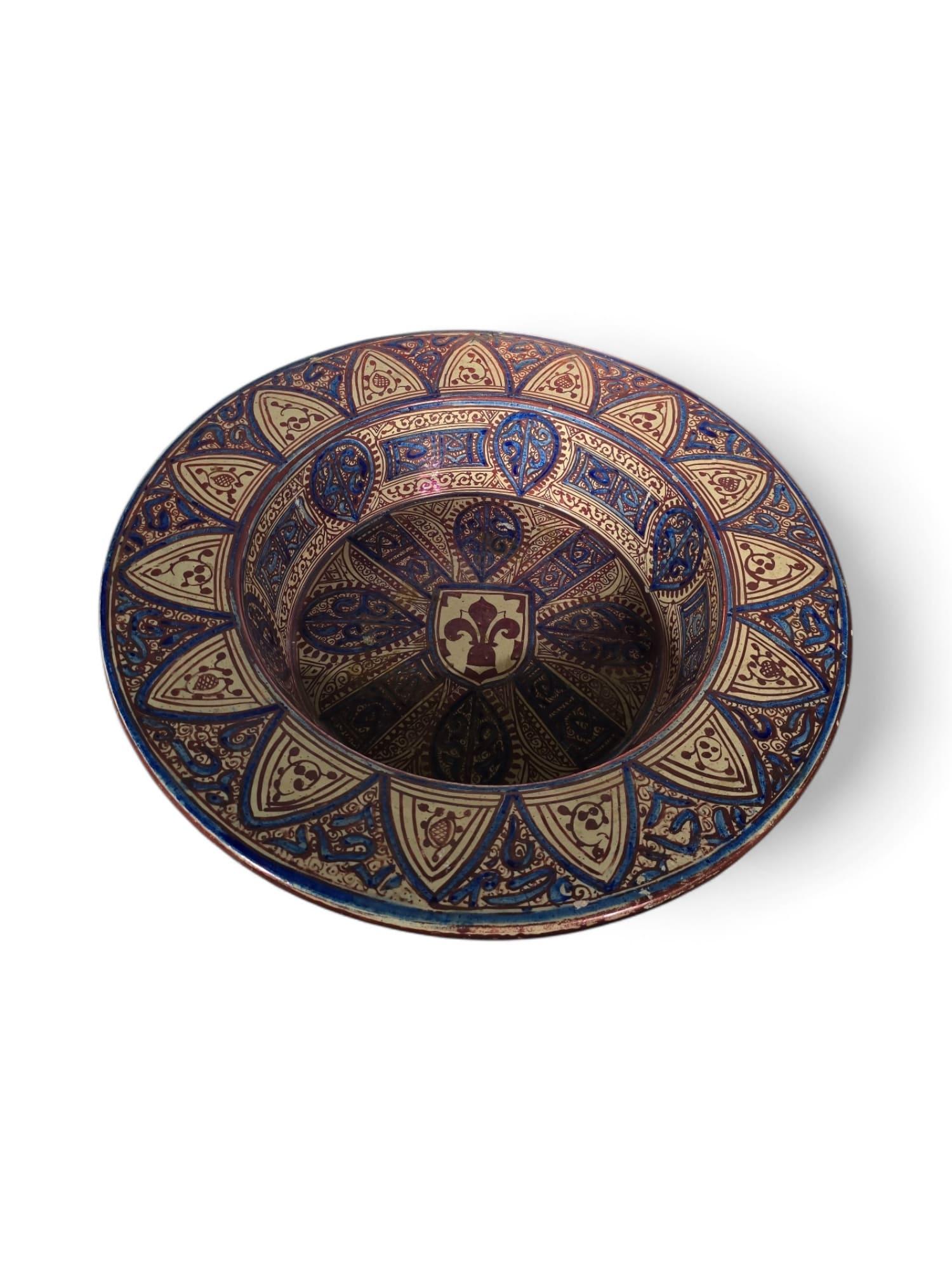 A magnificent ceramic plate measuring 47 cm in diameter and 10 cm in height, crafted in 19th-century Spain in the Nazari-Arabic style influenced by Al-Andalus culture. The piece showcases exquisite craftsmanship and intricate design, reflecting the