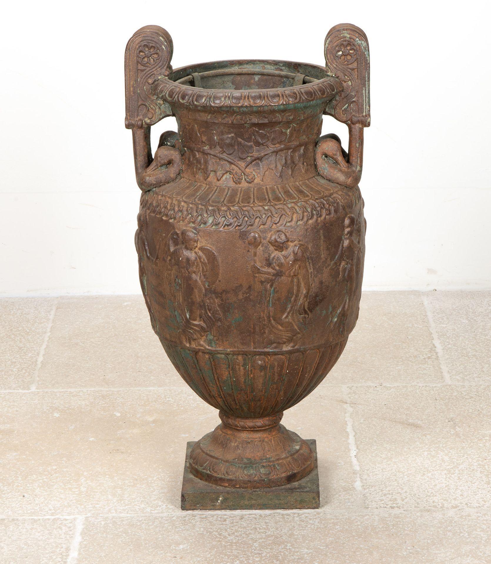 A large scale 19th Century English Country House garden or orangery cast iron classical urn.
After the antique Townley Vase. The urn is of krater form and retains it original wrought iron display liner.
In it's original condition with a gentle
