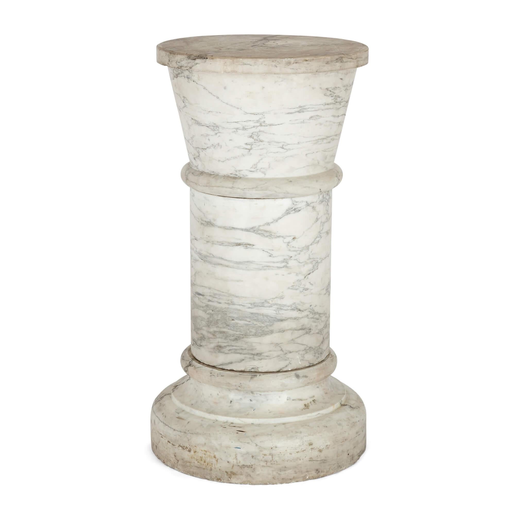 Large 19th century Neoclassical style white marble pedestal
Continental, late 19th century
Height 76cm, diameter 39cm

This pedestal sculpted from pristine white marble is a testament to the enduring allure of its Neoclassical design and to the