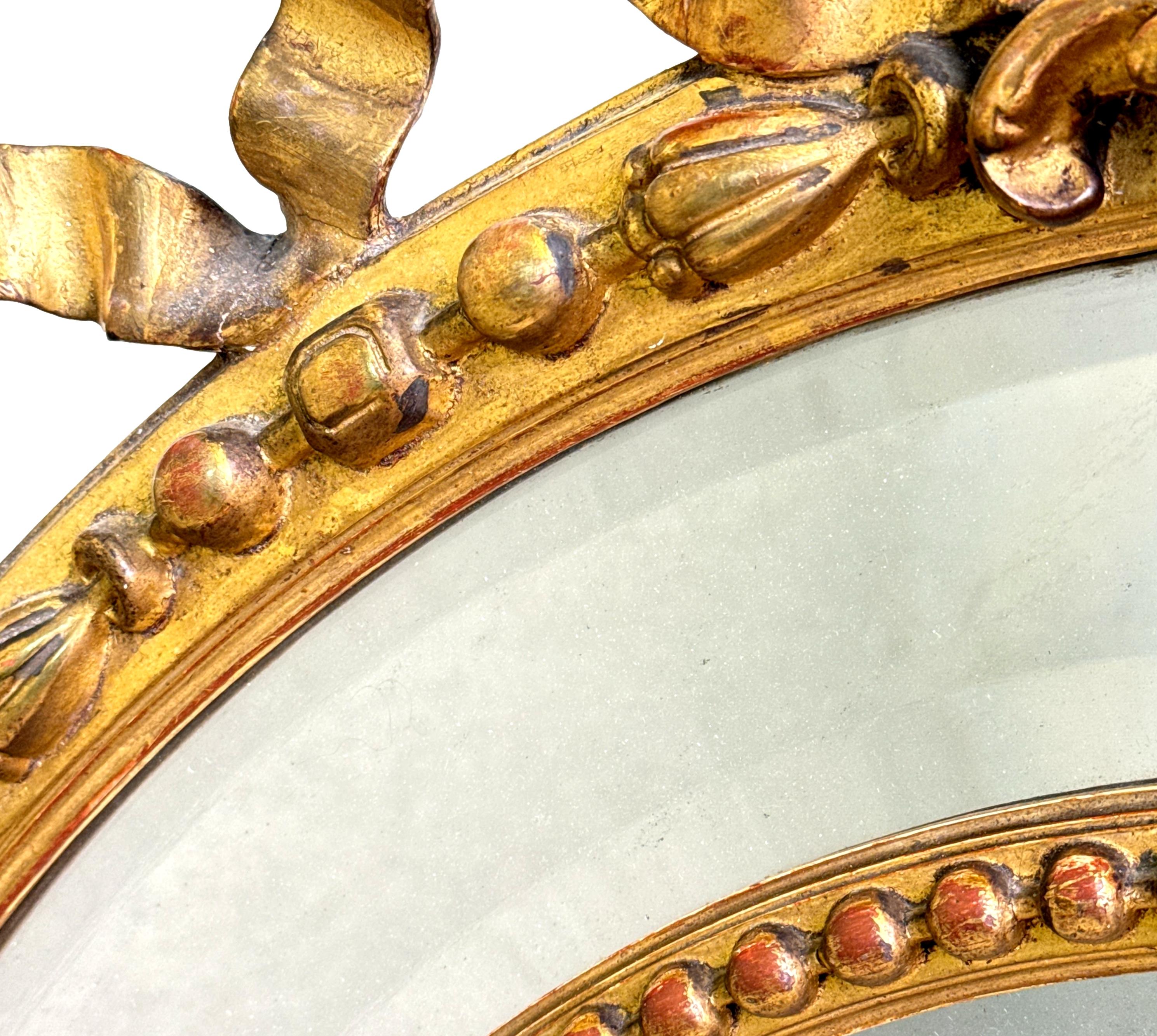 Grande specchio da parete ovale dorato del XIX secolo in vendita 1