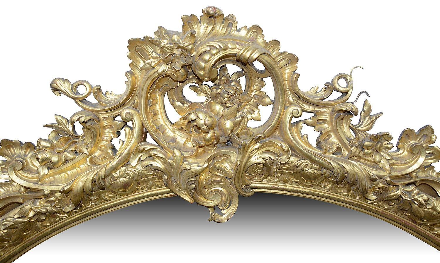 A good quality late 19th Century carved gilt wood and gesso oval, over mantel wall mirror. Having scrolling foliate and floral decoration surrounding the bevelled mirror plate.


Batch 75 UCKZN 60529