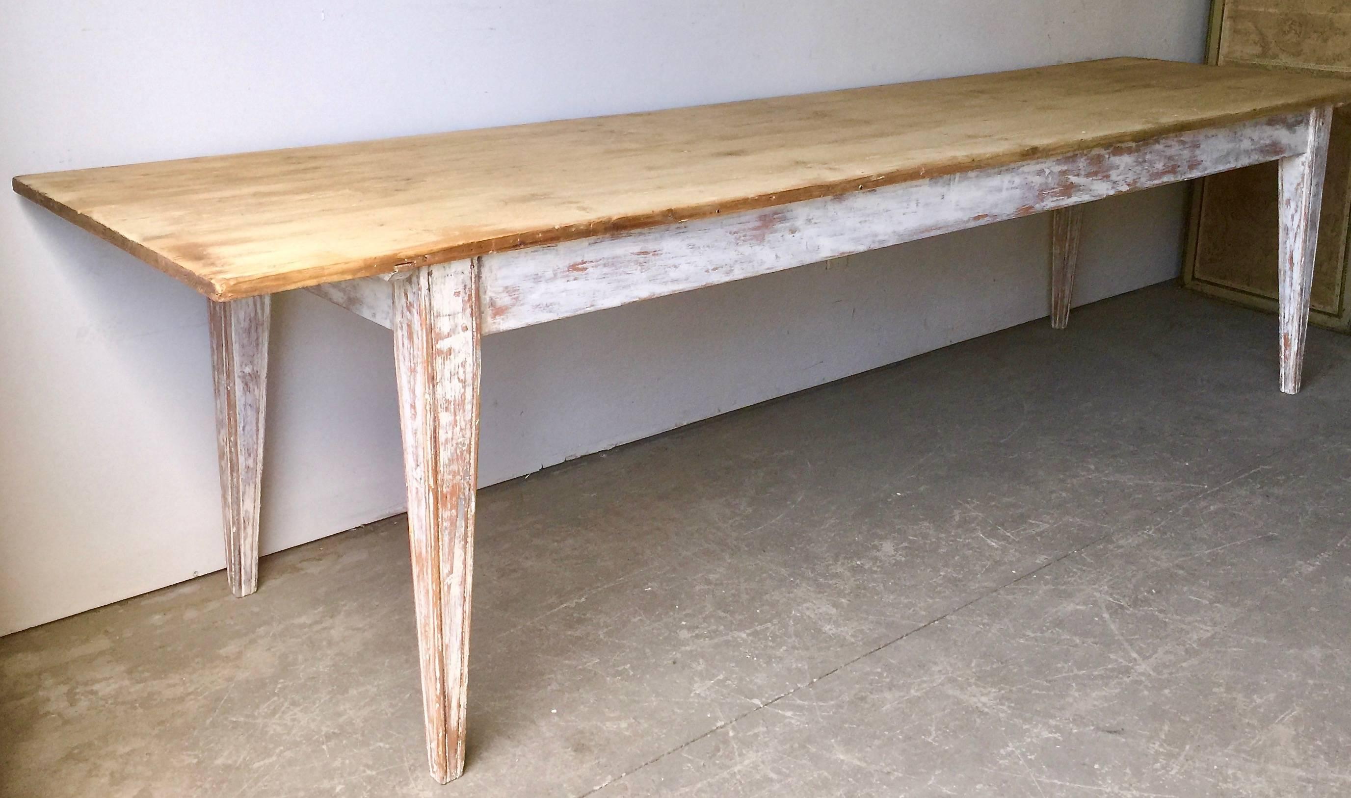 Large French country table with painted legs and nicely patinated natural pine top, France, late 19th/1900 century. 
Surprising pieces and objects, authentic, decorative and rare items. Discover them all.
