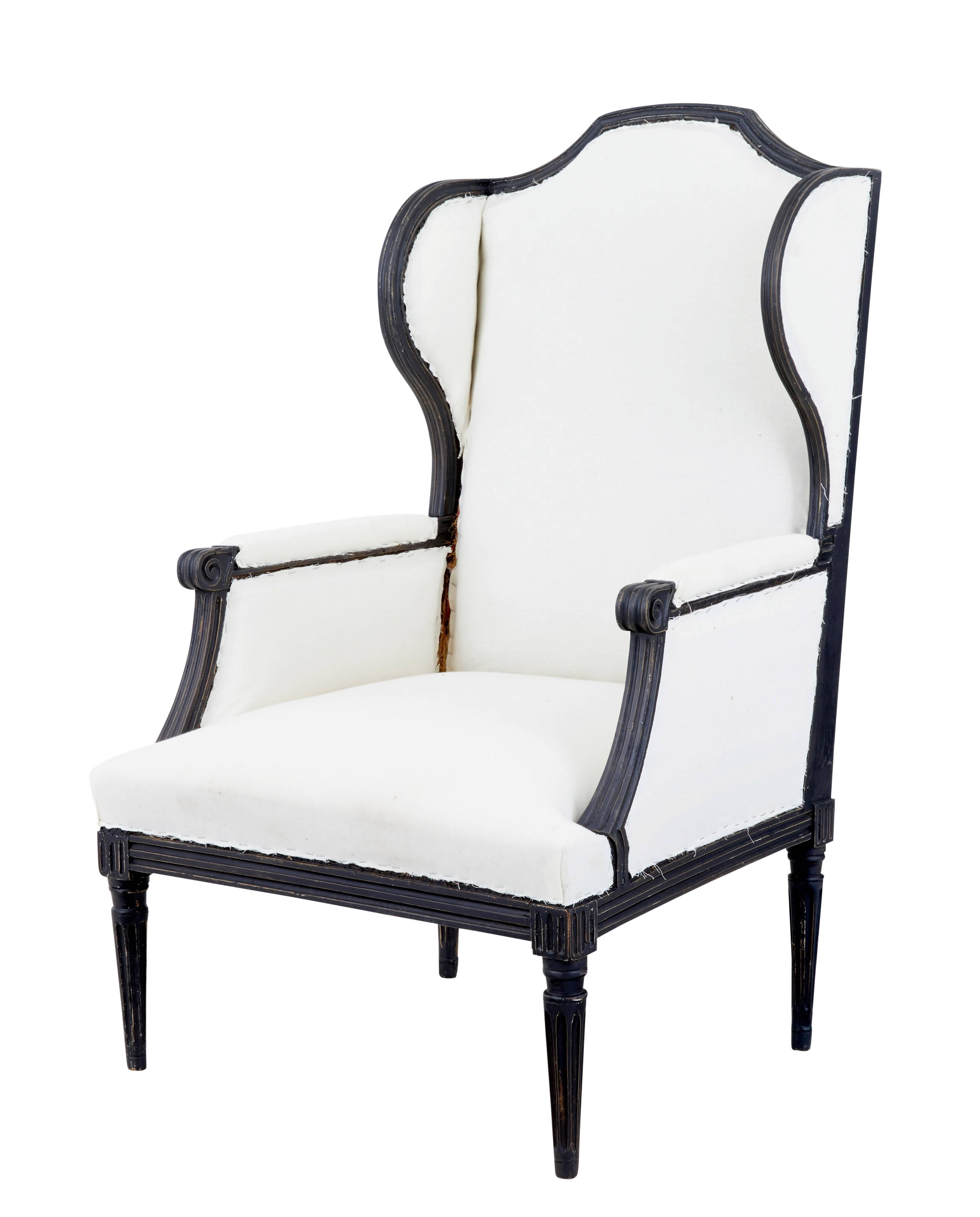 Fine 19th century wingback armchair of large proportions, circa 1880.

Very comfortable chair with elegant lines. Carved scroll arms, standing on fluted tapering legs.

Upholstery in good order, presented in white calico ready to be