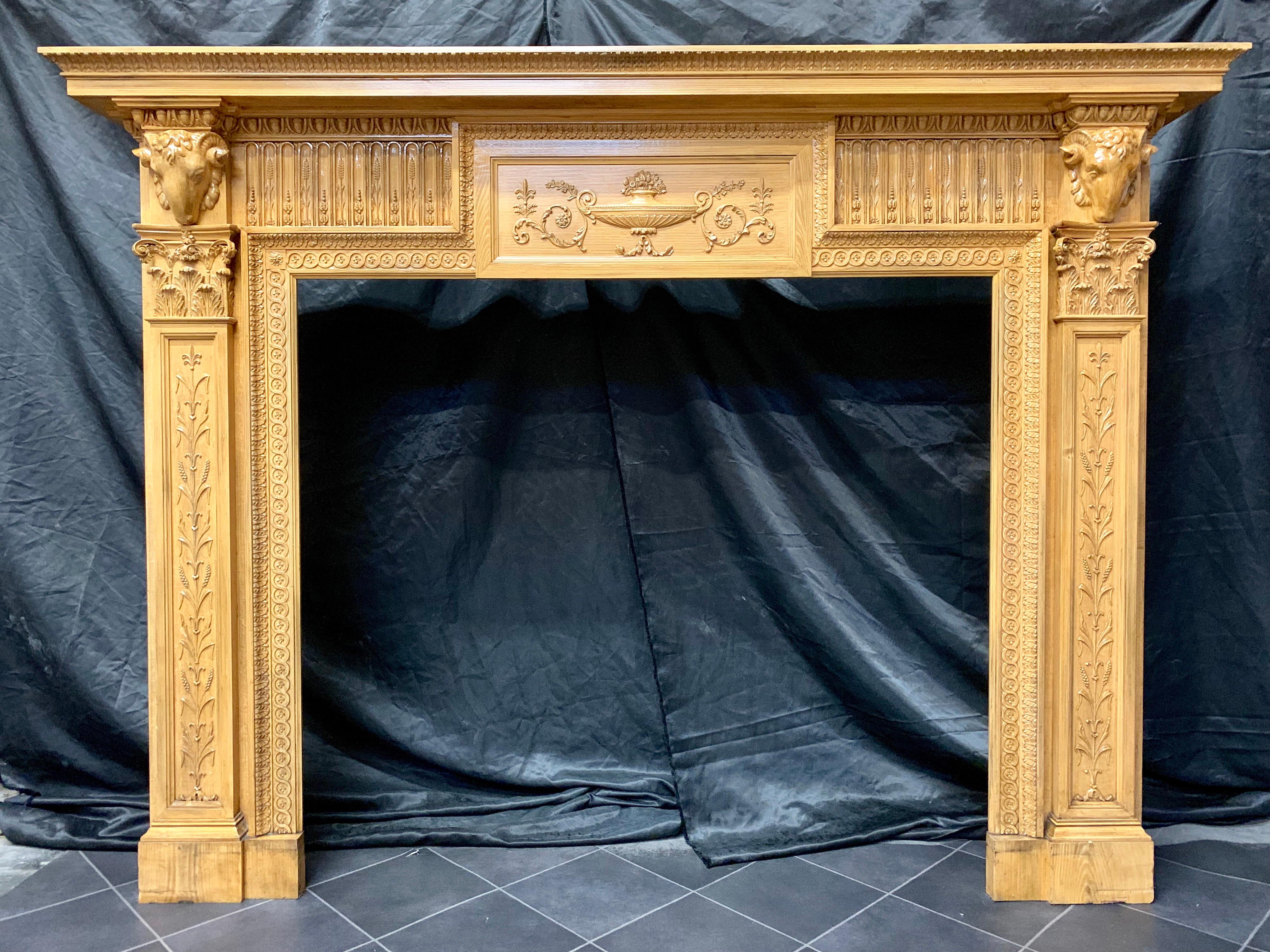 A large and elegant late 19th century pine and gesso fireplace surround in the Georgian manner, fully waxed and polished showing great colour. A large shelf with repeating acanthus leaf edge decoration with a secondary supporting shelf, above an