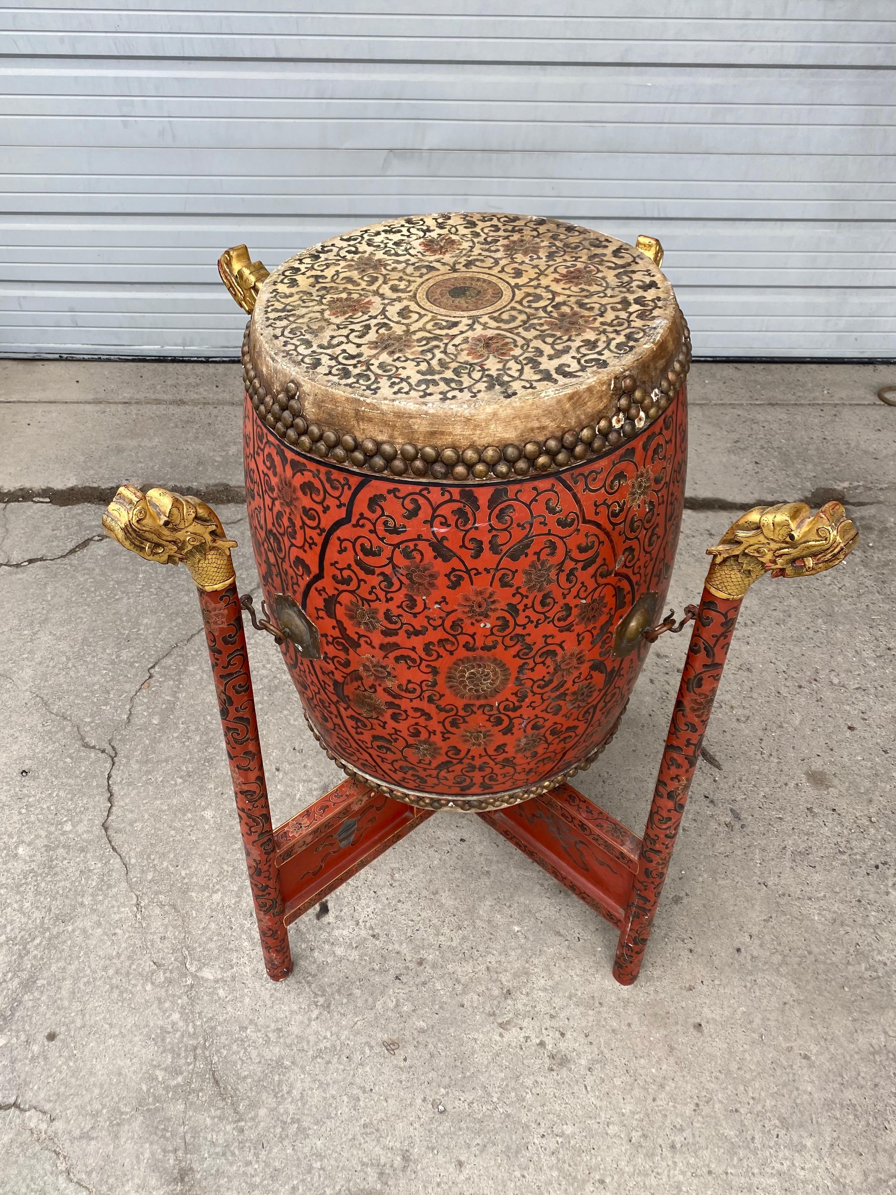 Large 19th century Qing Dynasty Chinese ceremonial lacquered drum, highly decorated, painted, gold gilded dragon head stand, hand decorated top and bottom animal skin, drum measures 22