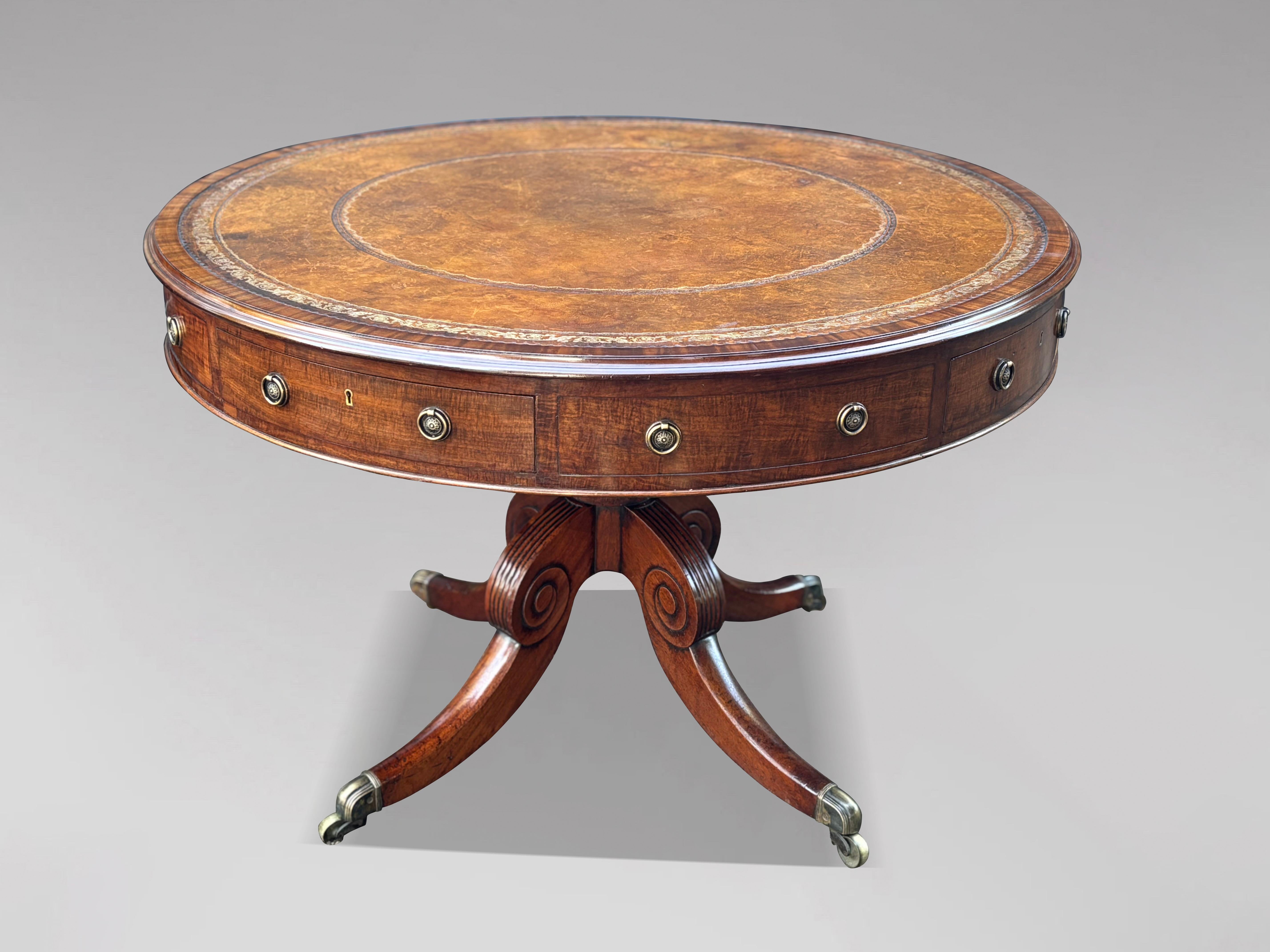 A Fine Early 19th Century Regency Mahogany Drum Top Library Table

This fine-quality early 19th-century Regency period mahogany circular drum top library table showcases exceptional craftsmanship and elegant late Georgian design. It features an