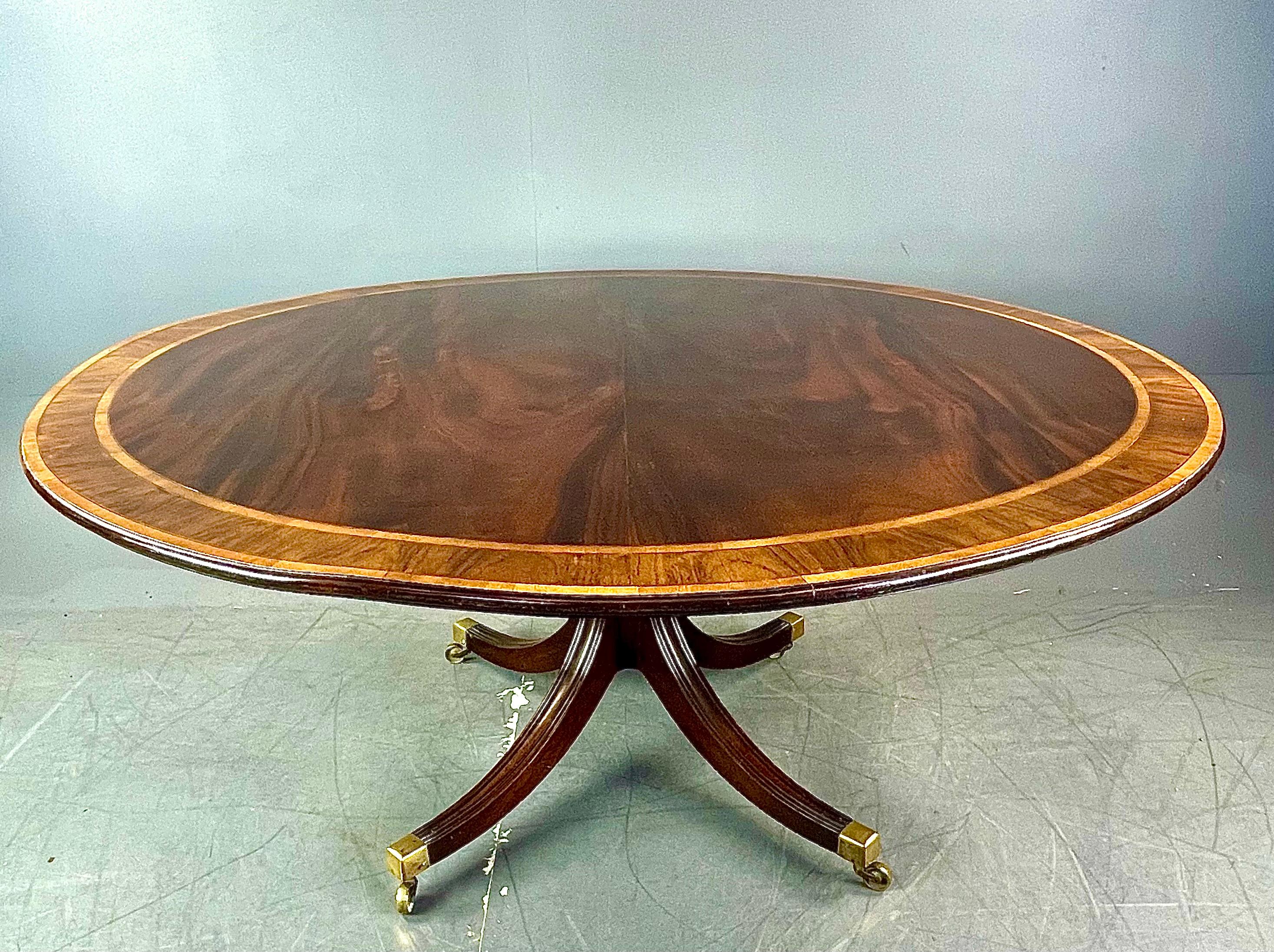 Fine large Regency solid mahogany curcular dining table that will seat eight with comfort being 62 inches diameter .circa 1820
The table has a magnificent solid mahogany top that has a good grain and colour with rosewood and boxwood banding