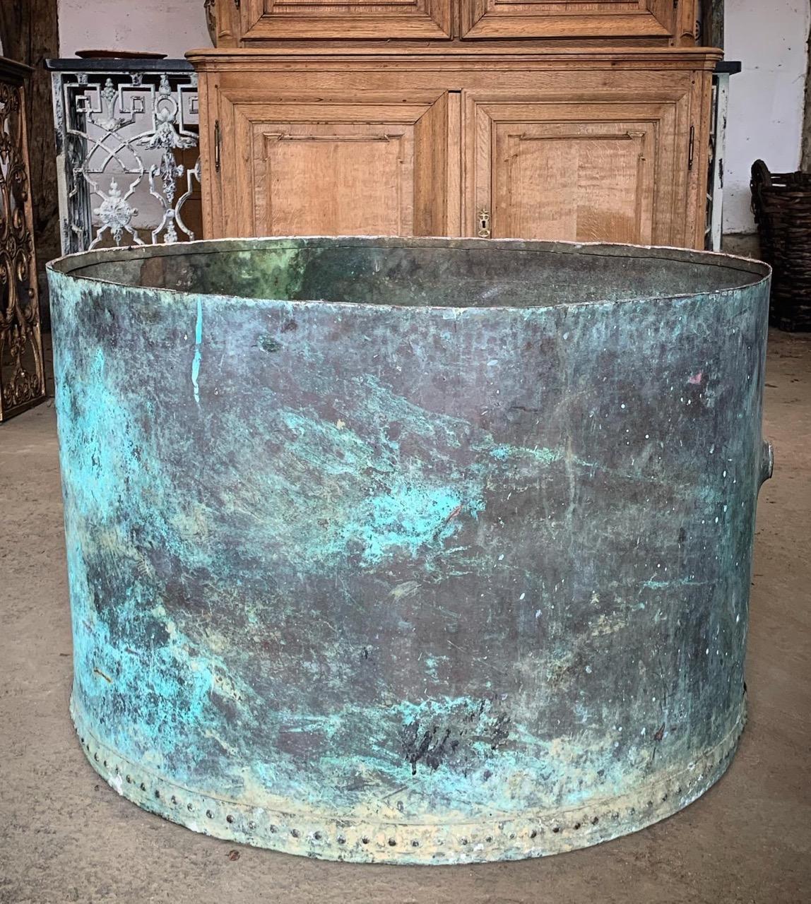 A lovely large 19th century riveted copper tank from France. The copper has a nice natural verdigris colour. This would make a wonderful garden planter. It does have holes where pipe work was attached so is not water tight. But the holes would make