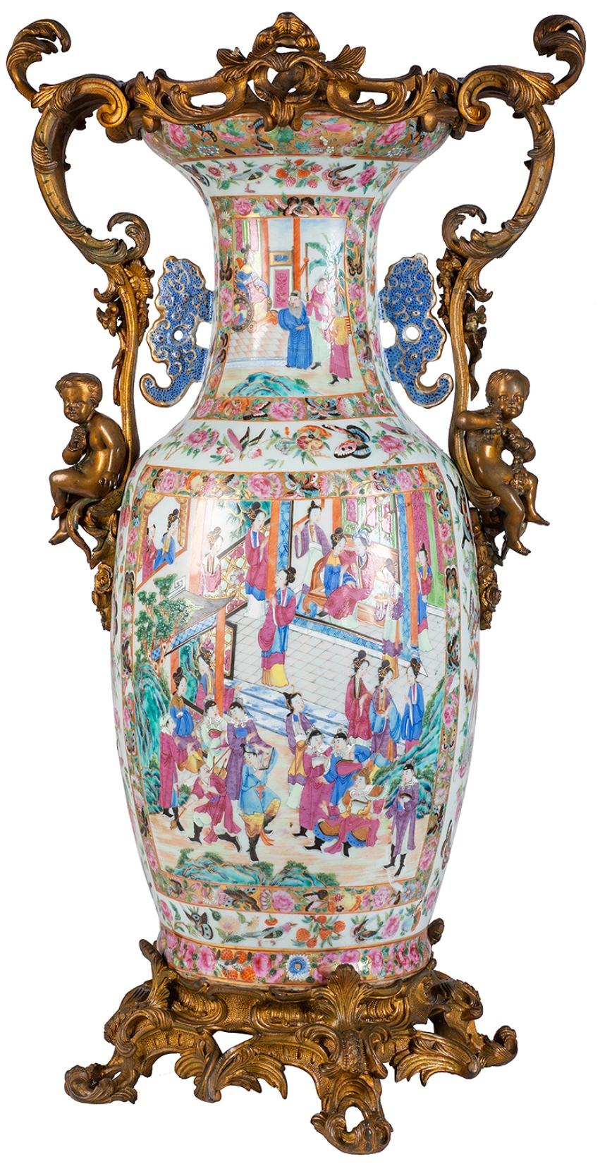 A very impressive 19th century Chinese rose medallion / canton vase / lamp, having wonderful gilded ormolu scrolling foliate Rococo style mounts with putti seated on either side. The vase having beautifully hand painted inset panels depicting