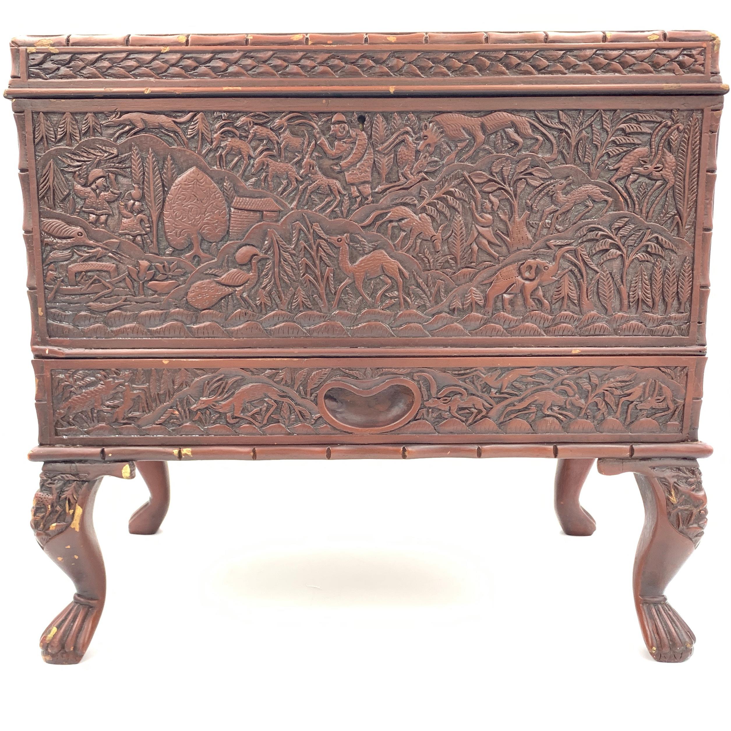 The dense carving of this 19th century South Indian sandalwood jewellery box is so lively and animated.